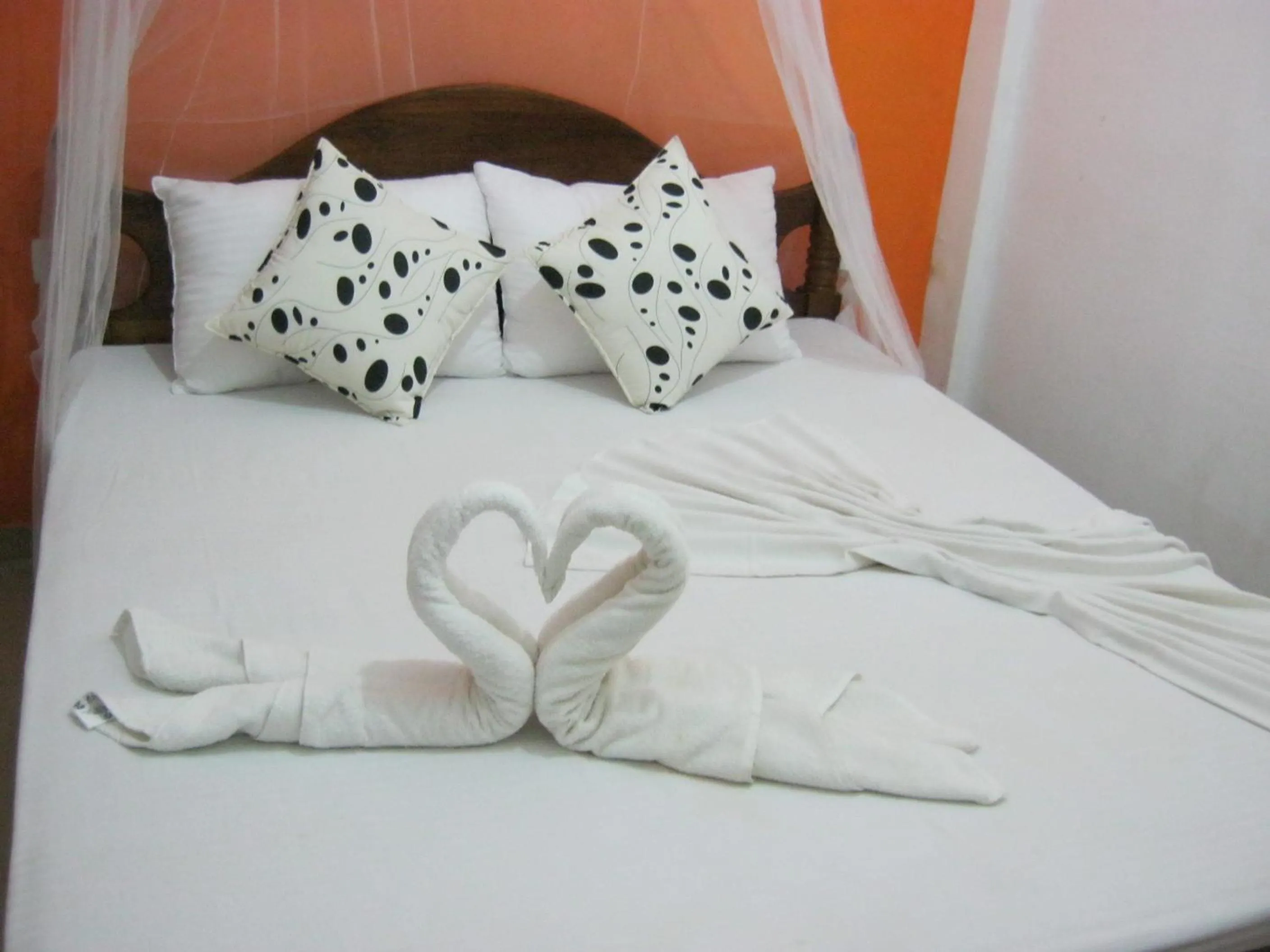 Bed in Arcade Beach Hotel
