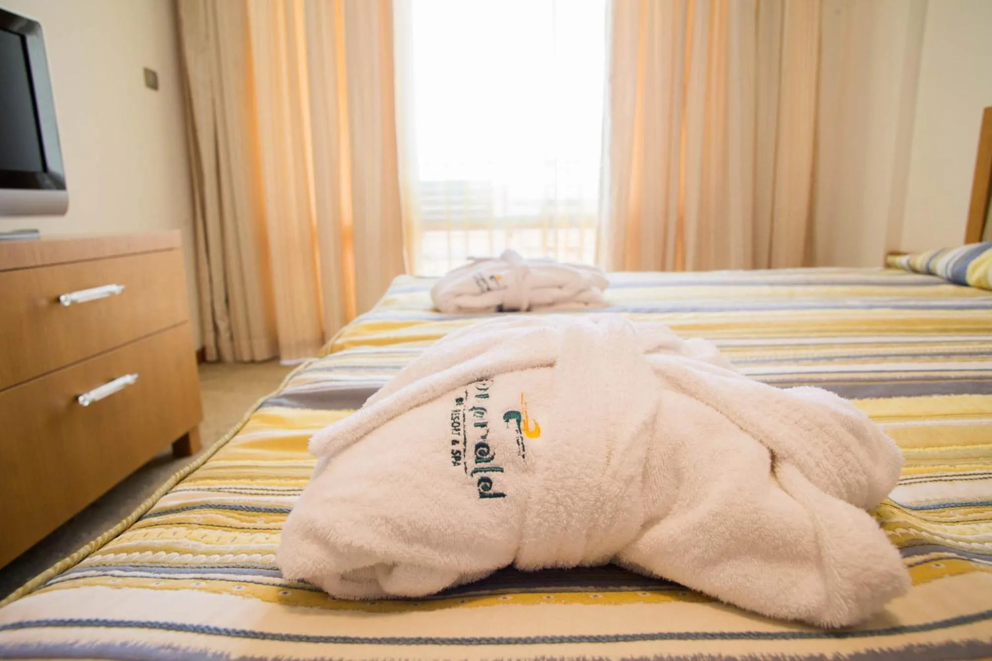 Bed in Emerald Beach Resort & Spa