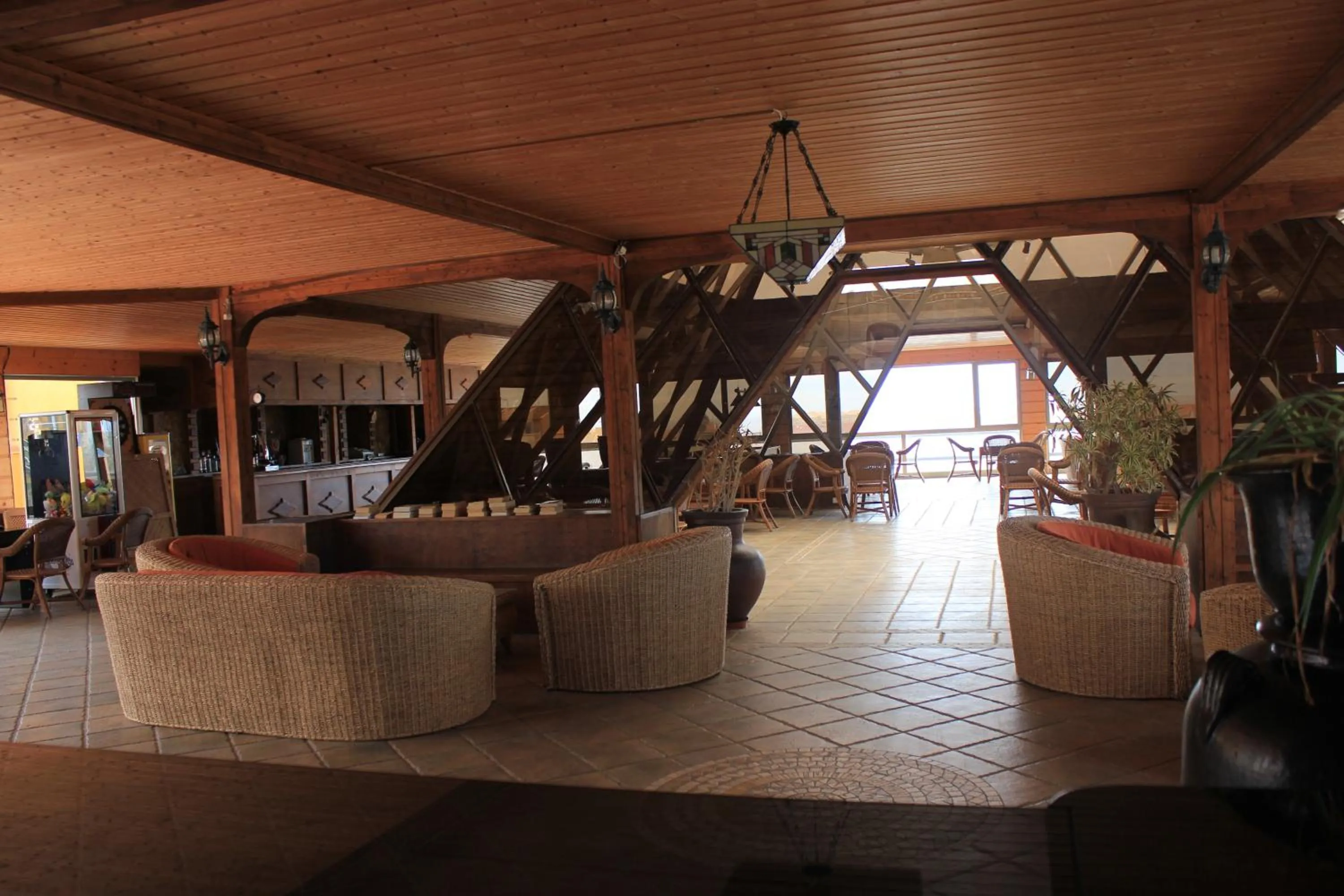 Communal lounge/ TV room in Aparthotel la Piramide