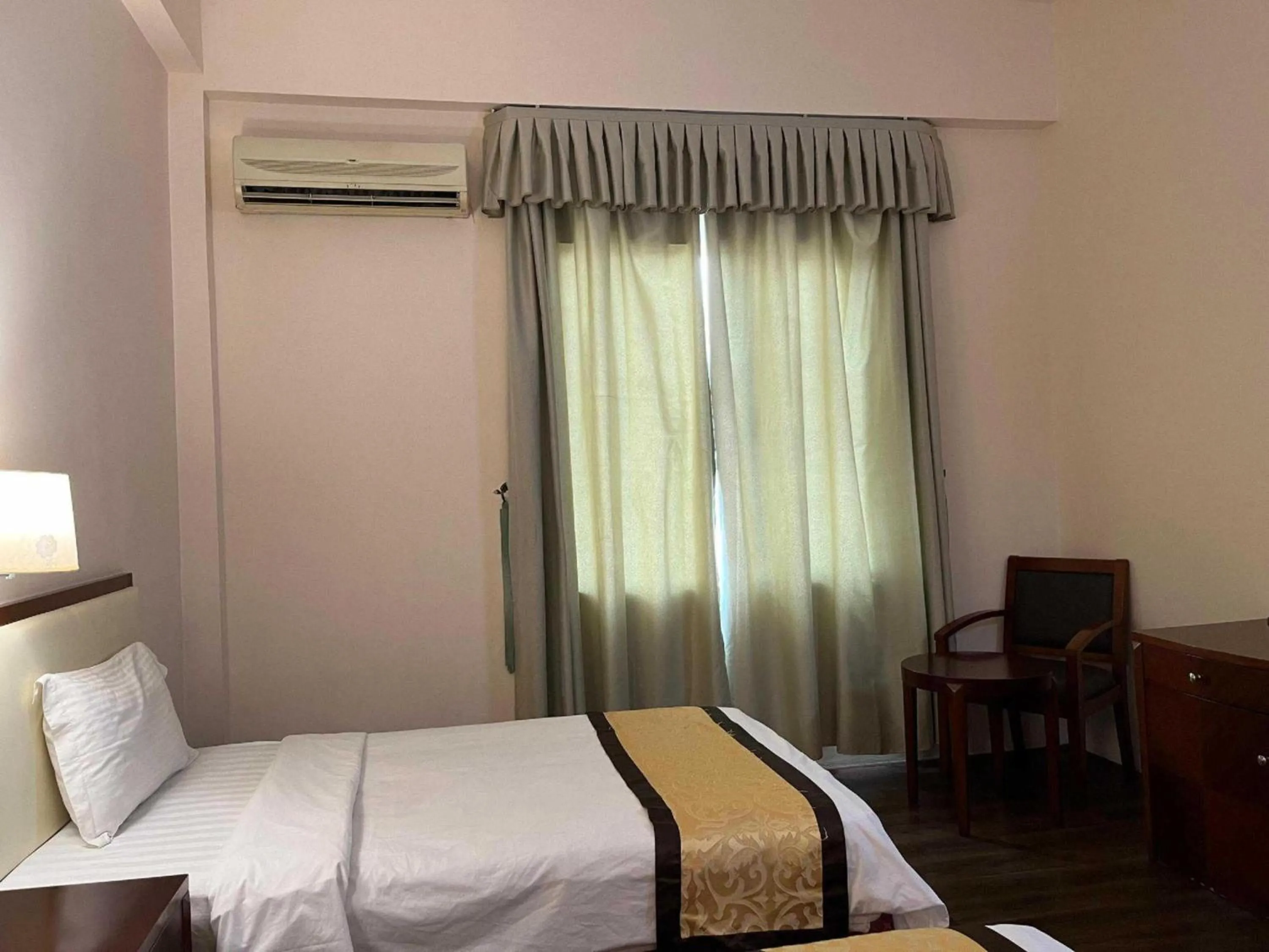 View (from property/room), Bed in Hotel O Atari Inn