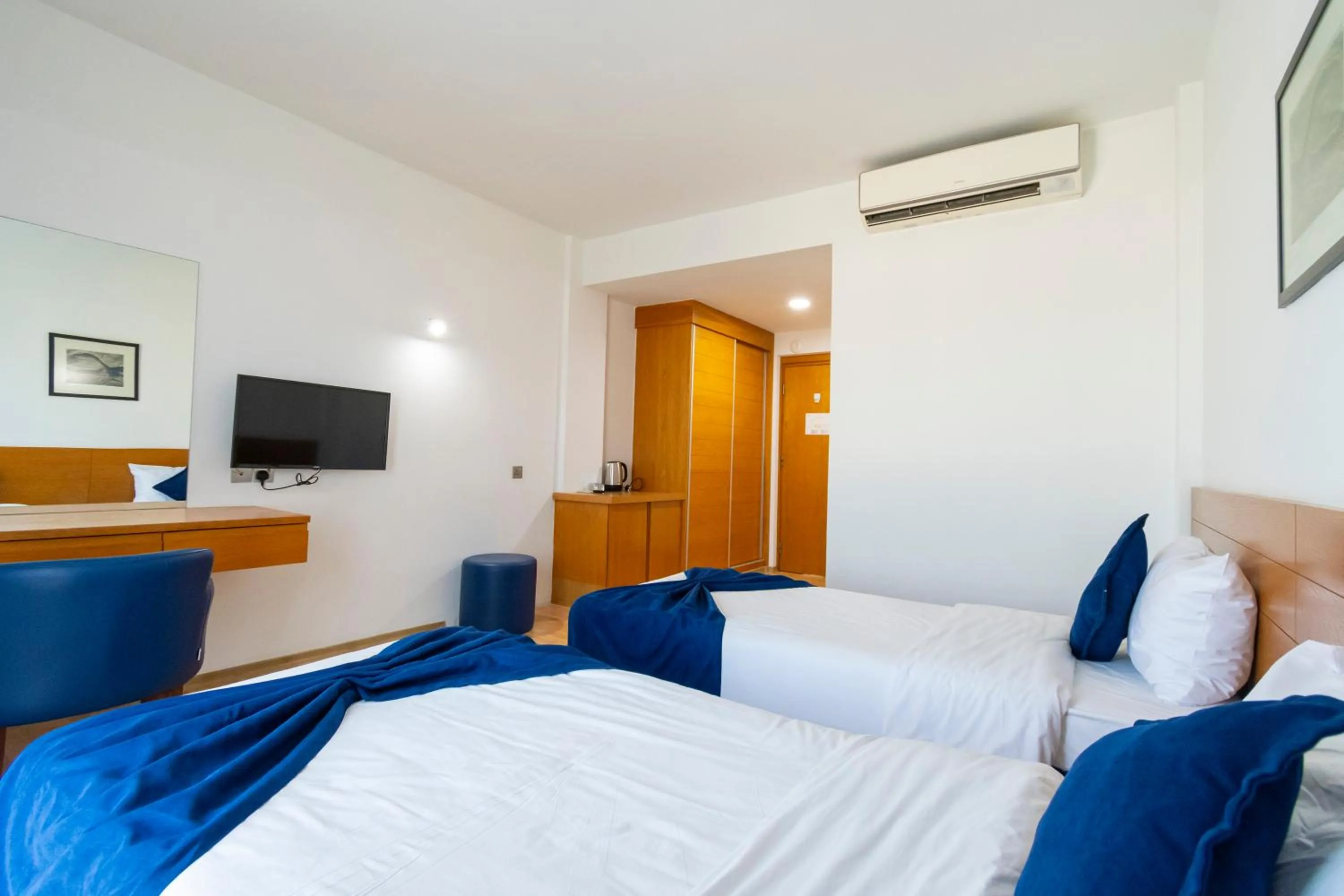 Bed in Bellapais Oasis Hotel