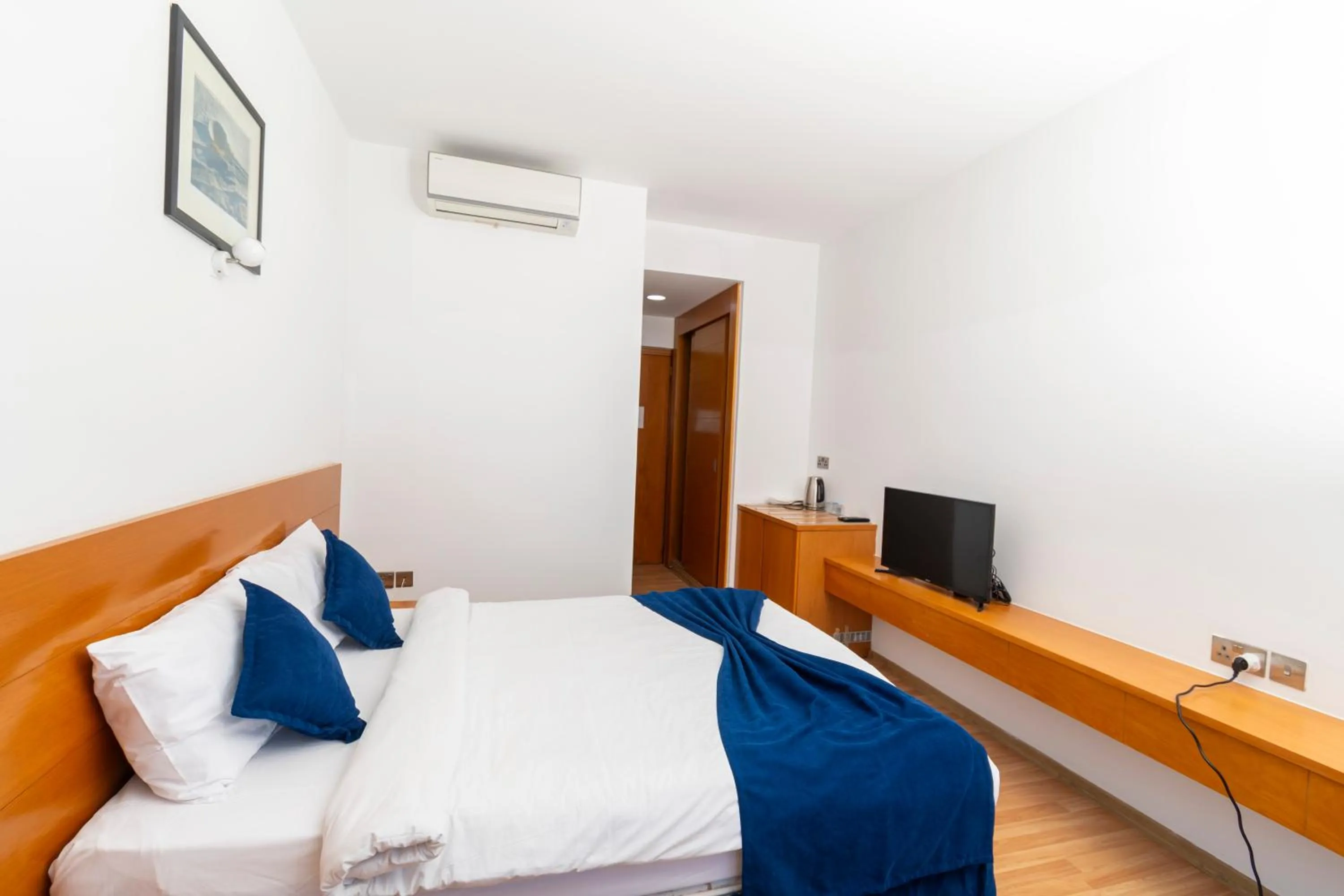 Bed in Bellapais Oasis Hotel