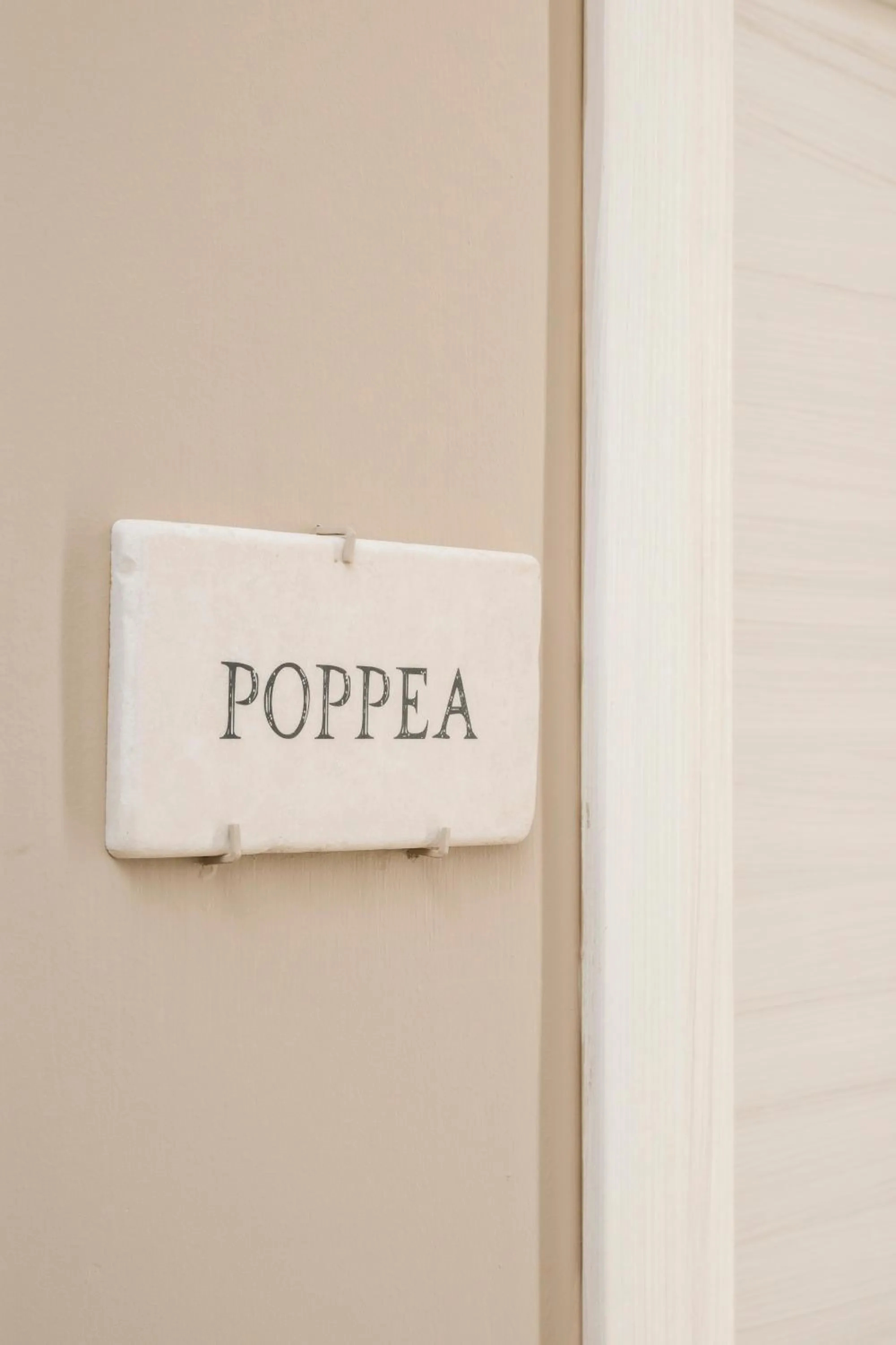 Logo/Certificate/Sign in The Roman Empire Guesthouse