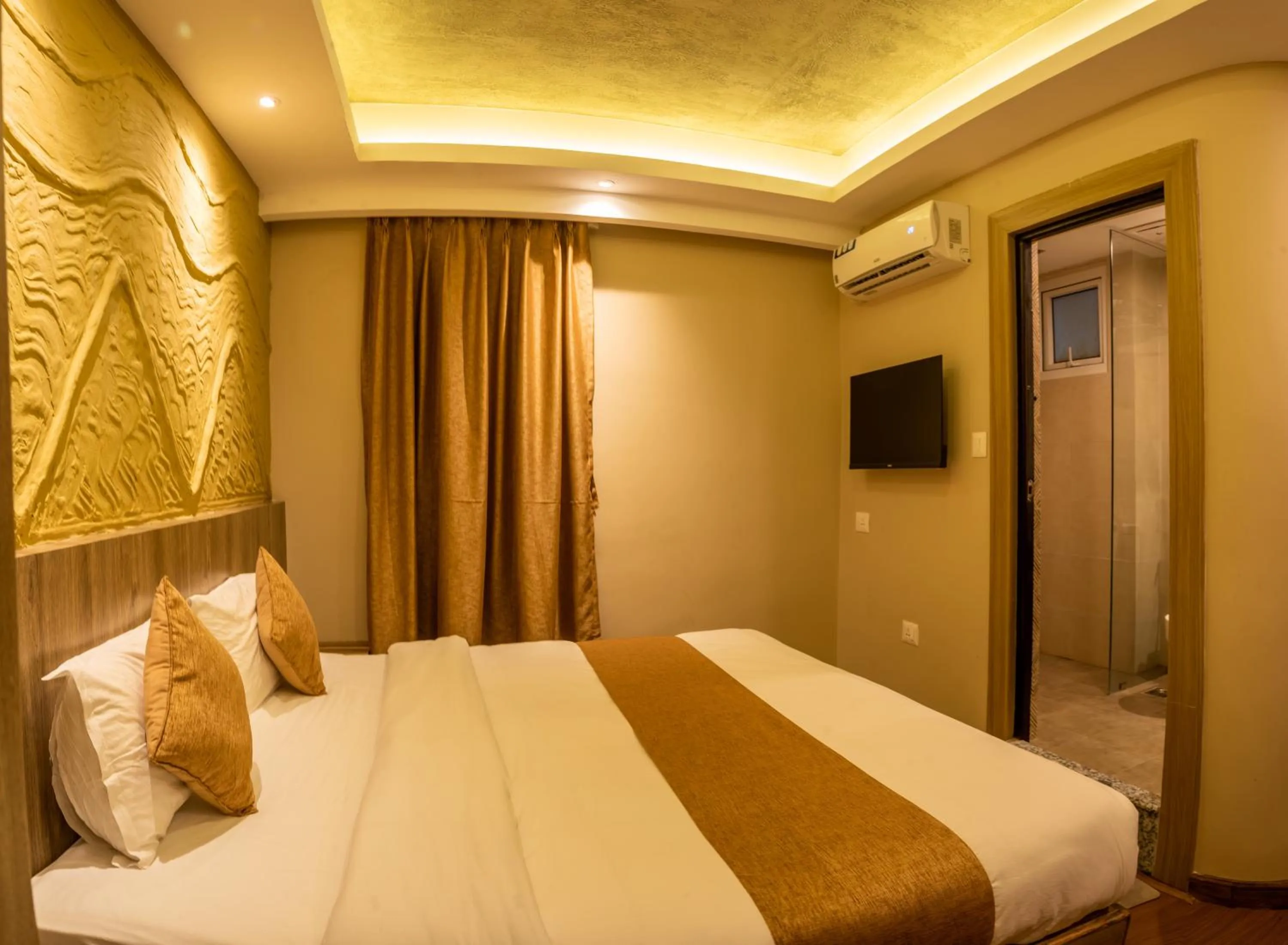 Bed in Divya Boutique Inn