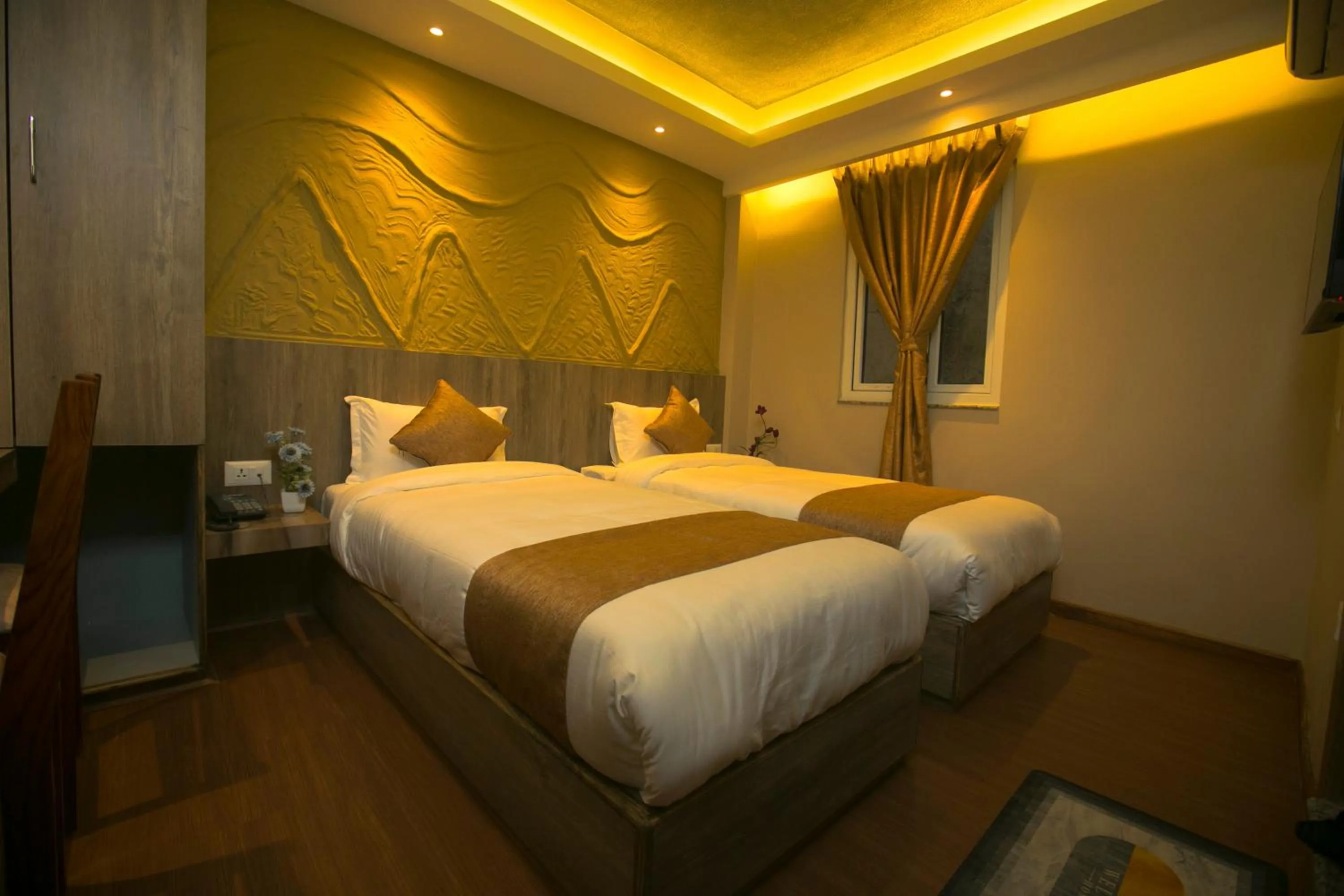 Bed in Divya Boutique Inn