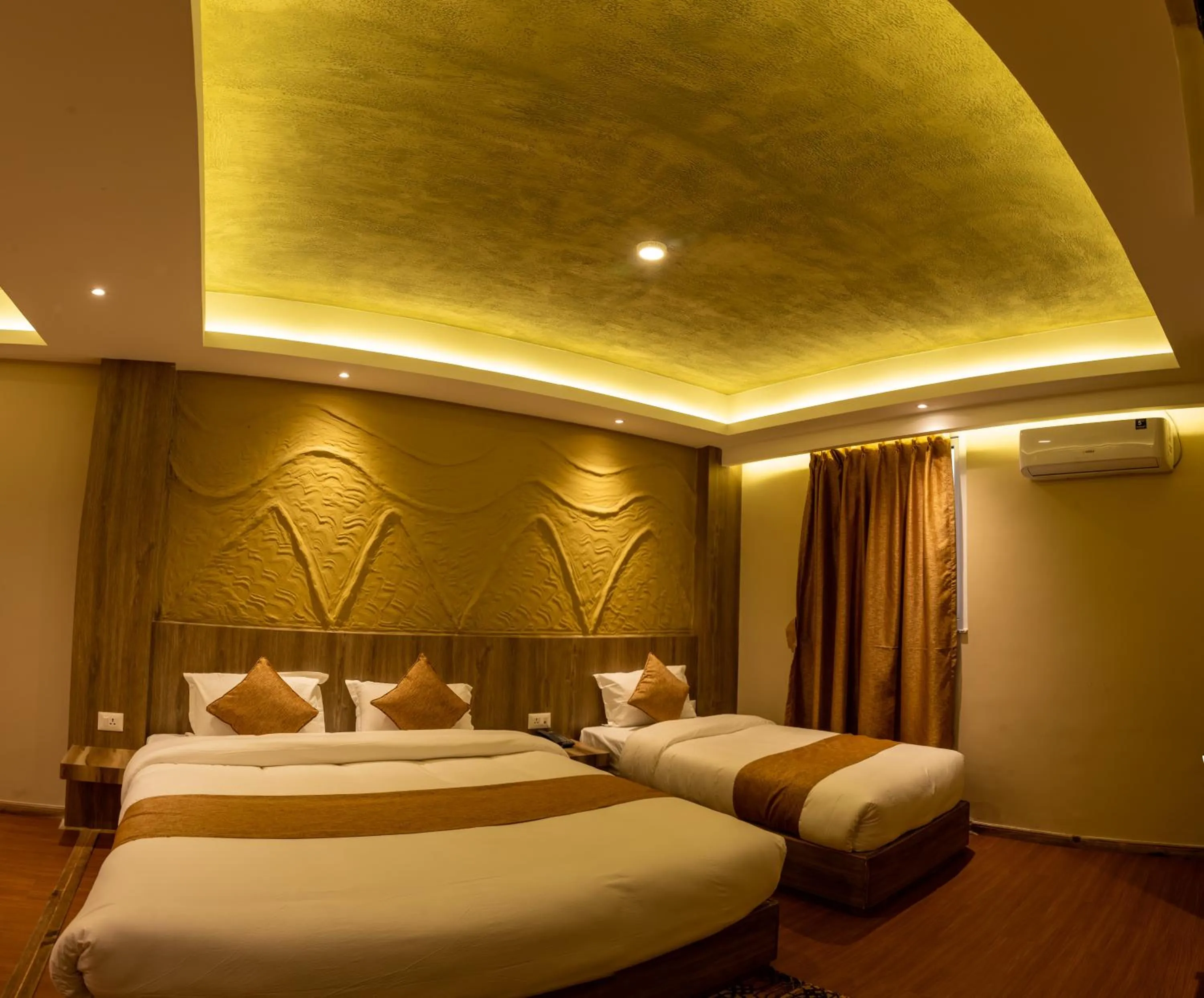Bed in Divya Boutique Inn