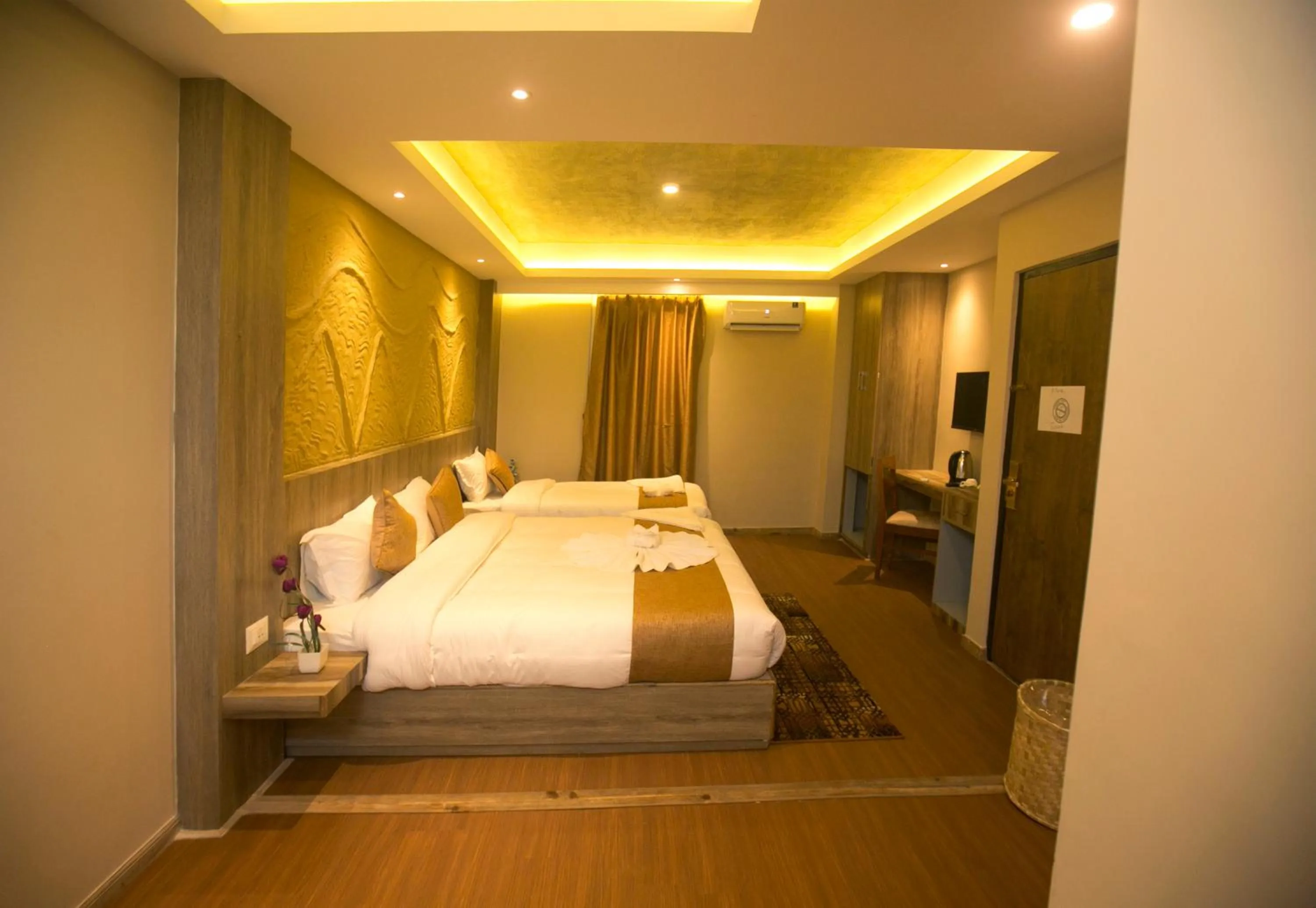 Bed in Divya Boutique Inn