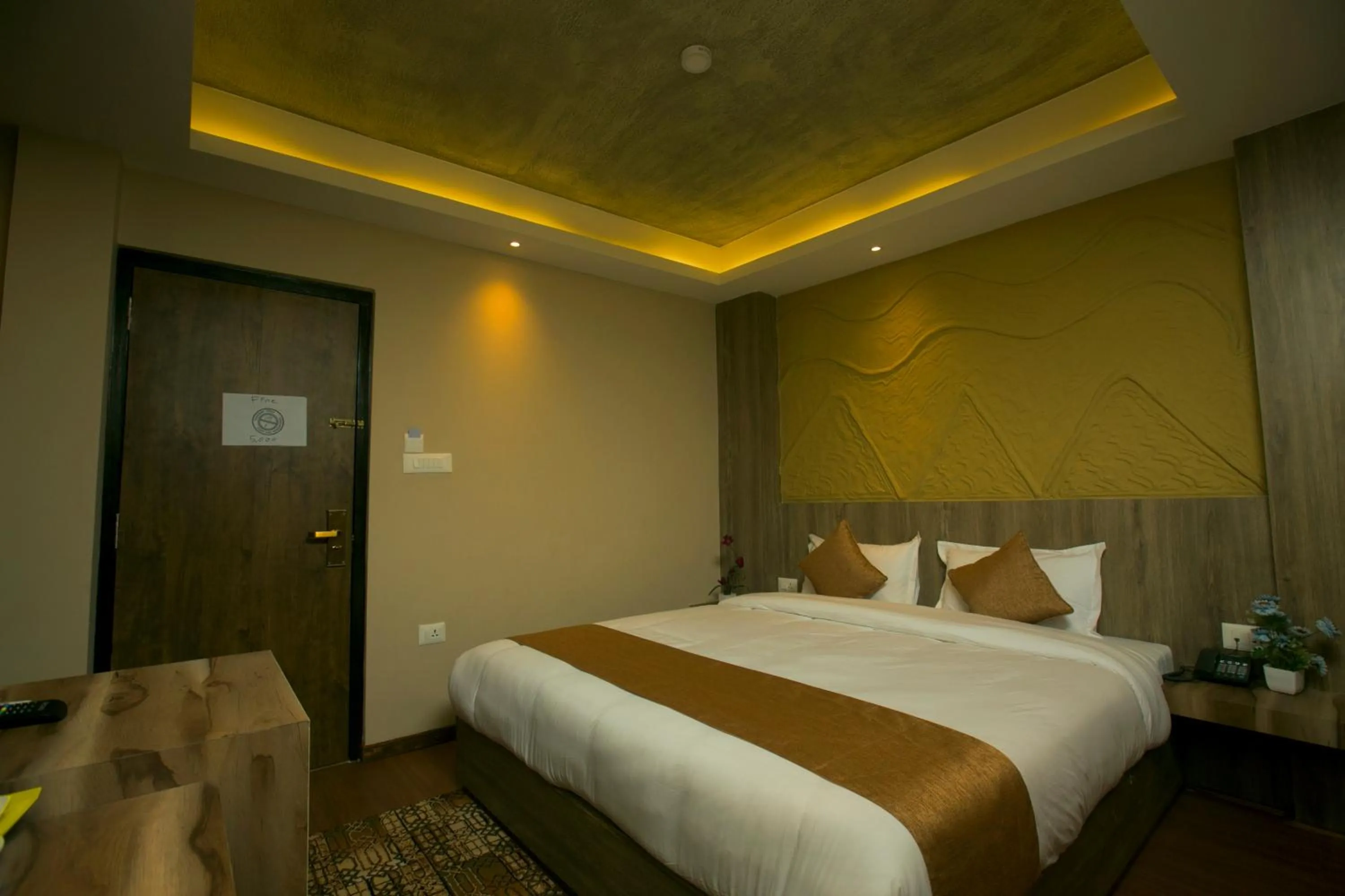 Bed in Divya Boutique Inn