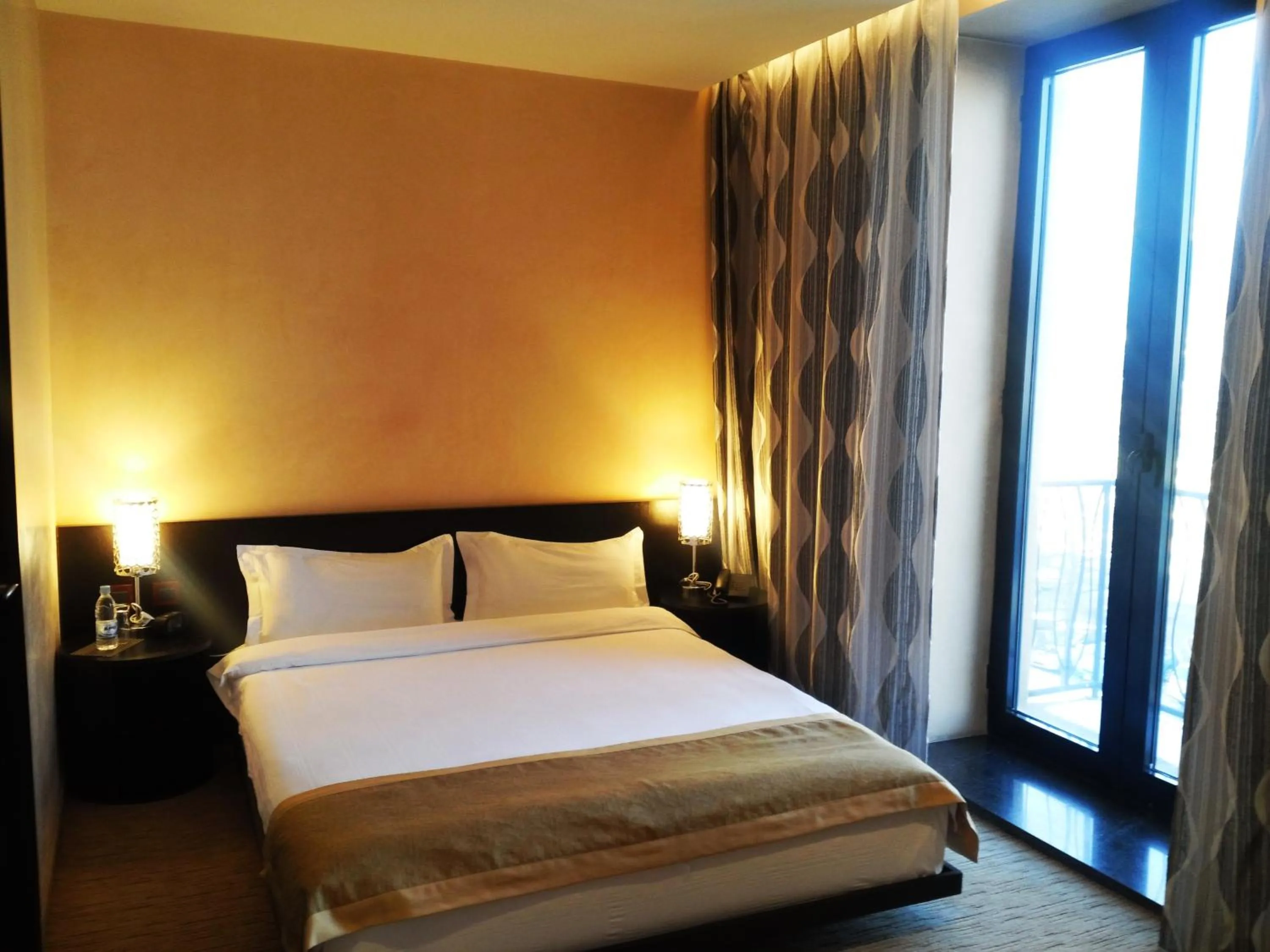 Balcony/Terrace, Bed in Urgoo hotel