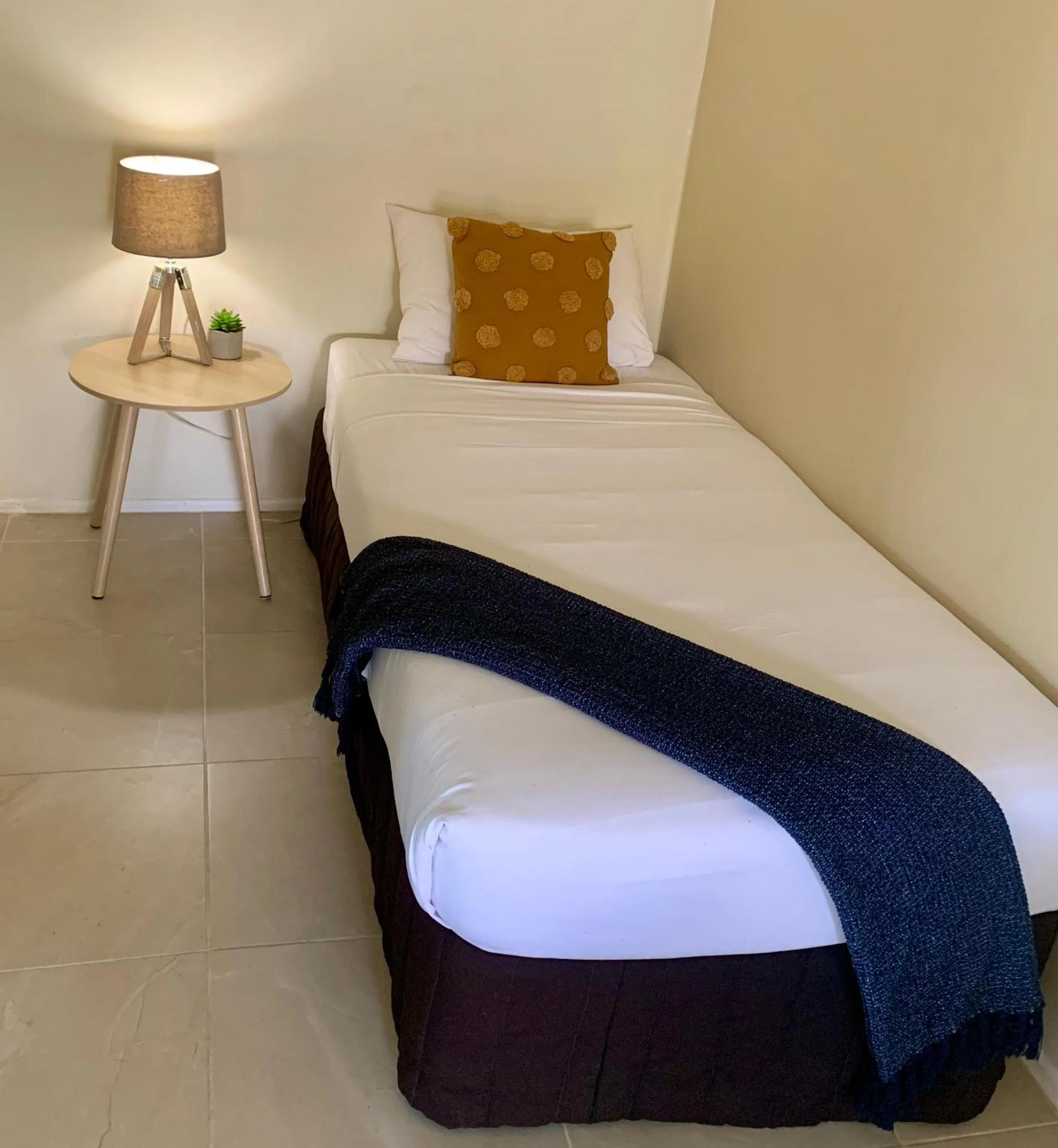 Bed in Montville Holiday Apartments