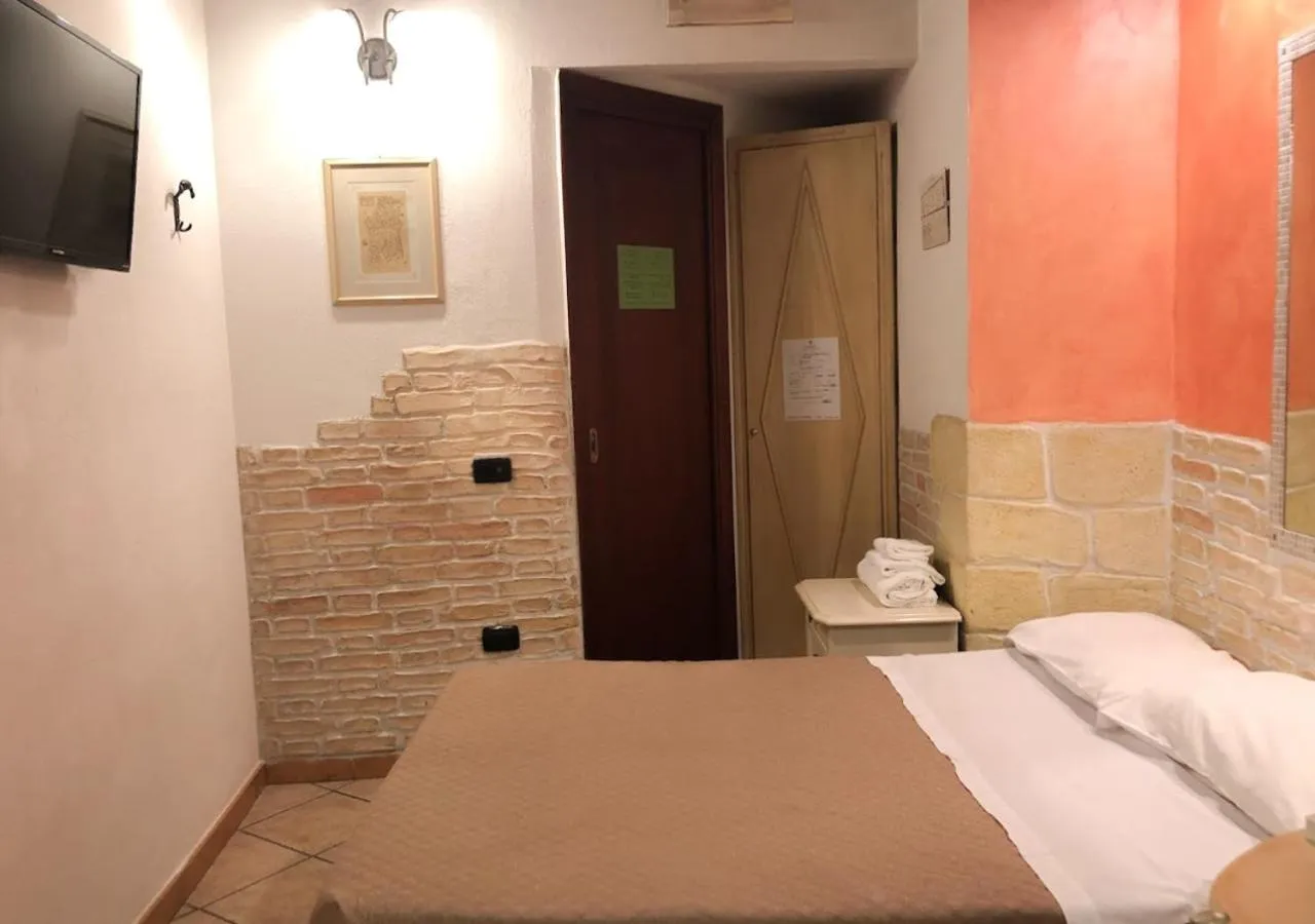 Photo of the whole room, Bed in Sardinia Domus