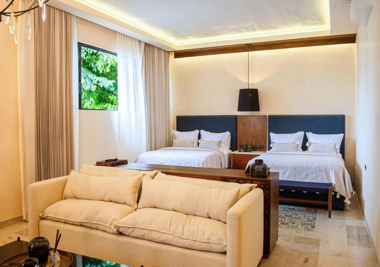 Bed in Adoro Hotel Boutique