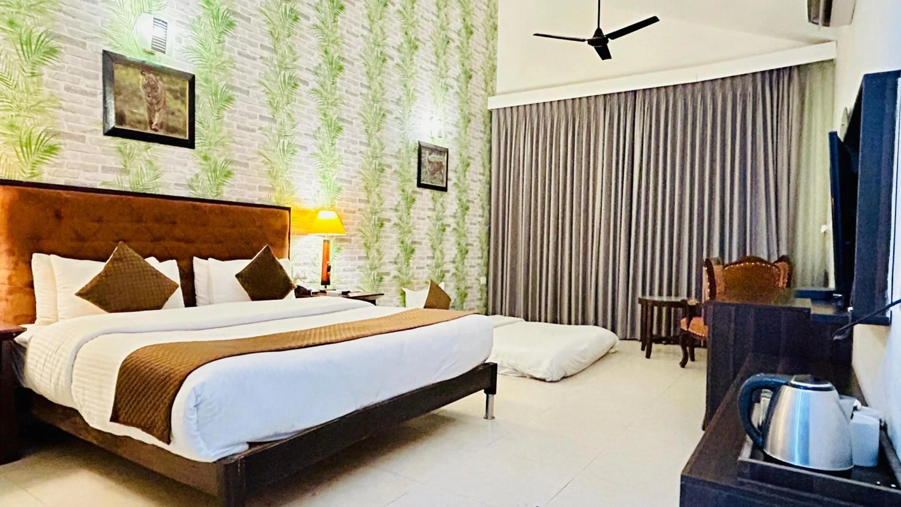 Bed in Click Resort Corbett Tiger Den