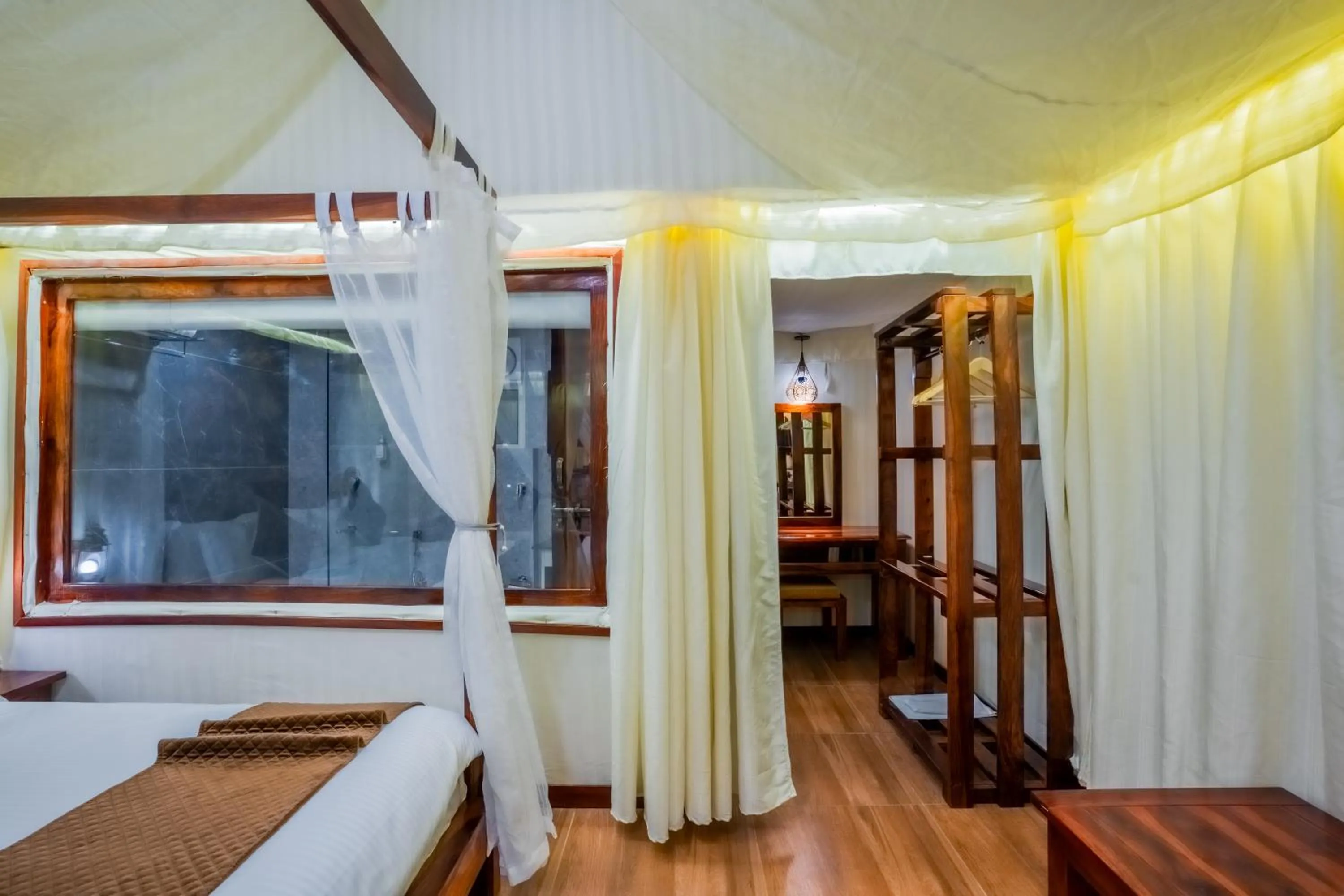 Bed in Click Resort Corbett Tiger Den