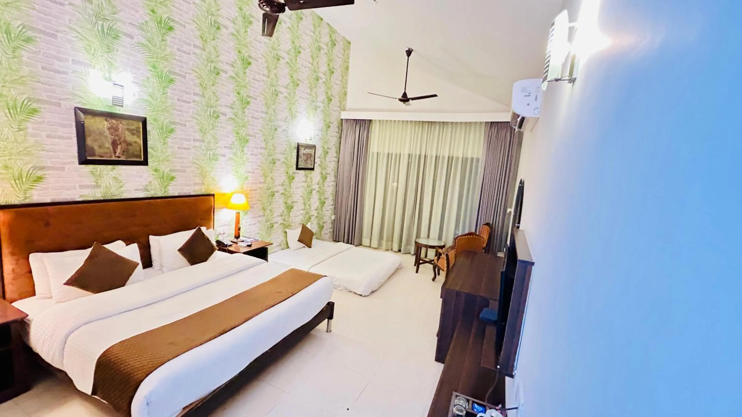 Bed in Click Resort Corbett Tiger Den