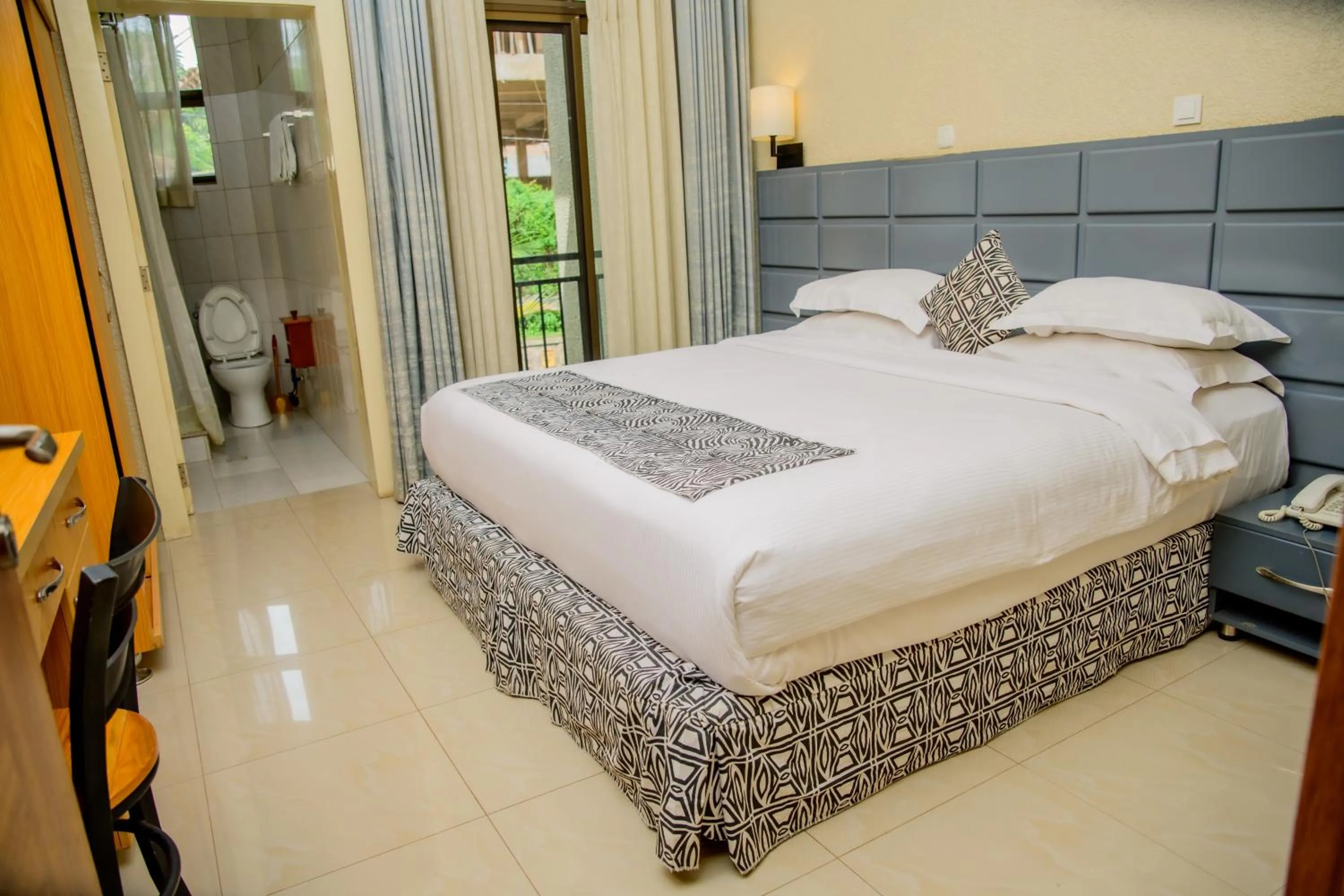 Bed in Quality Inn Hotel Kigali