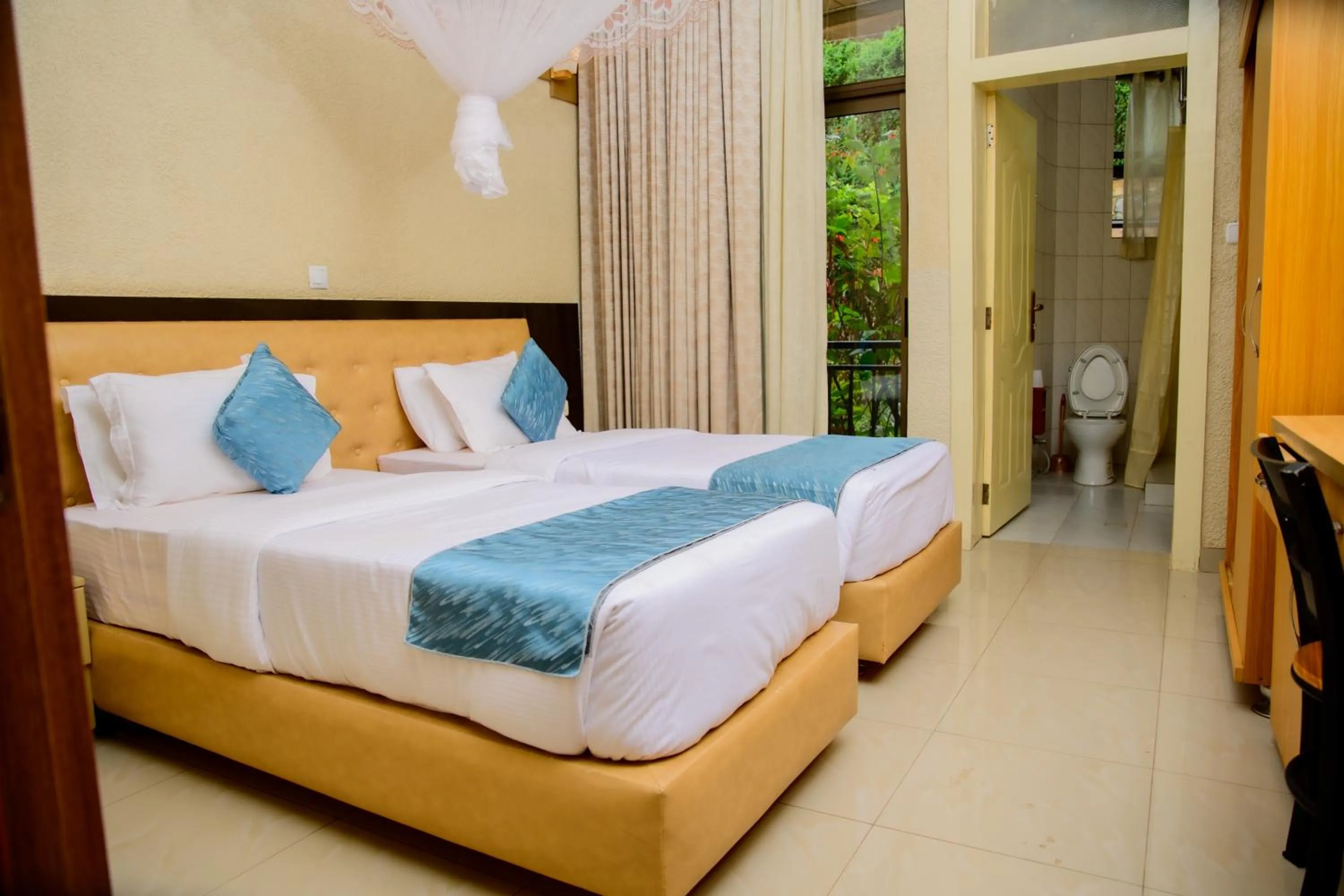 Bed in Quality Inn Hotel Kigali