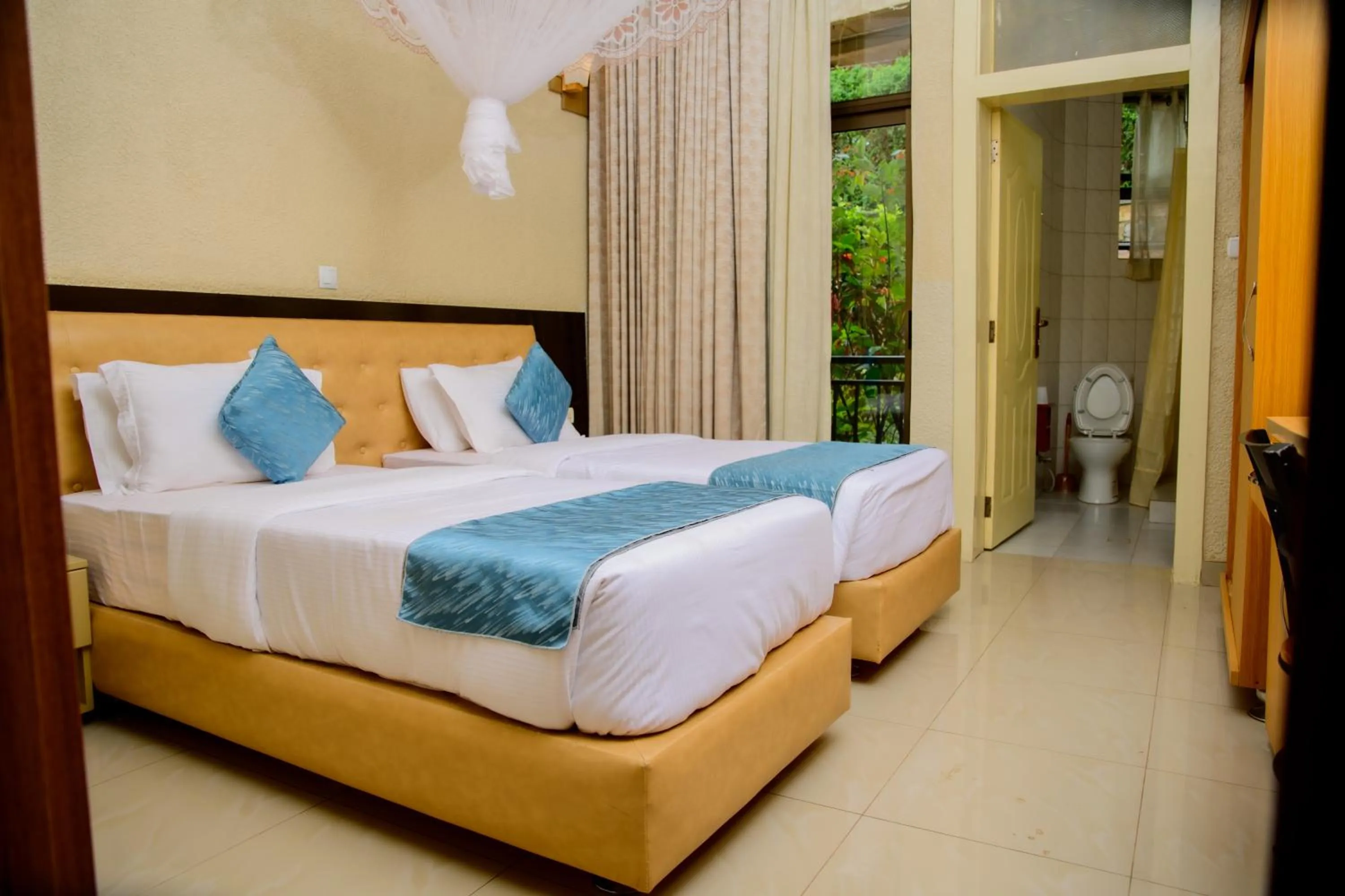 Bed in Quality Inn Hotel Kigali