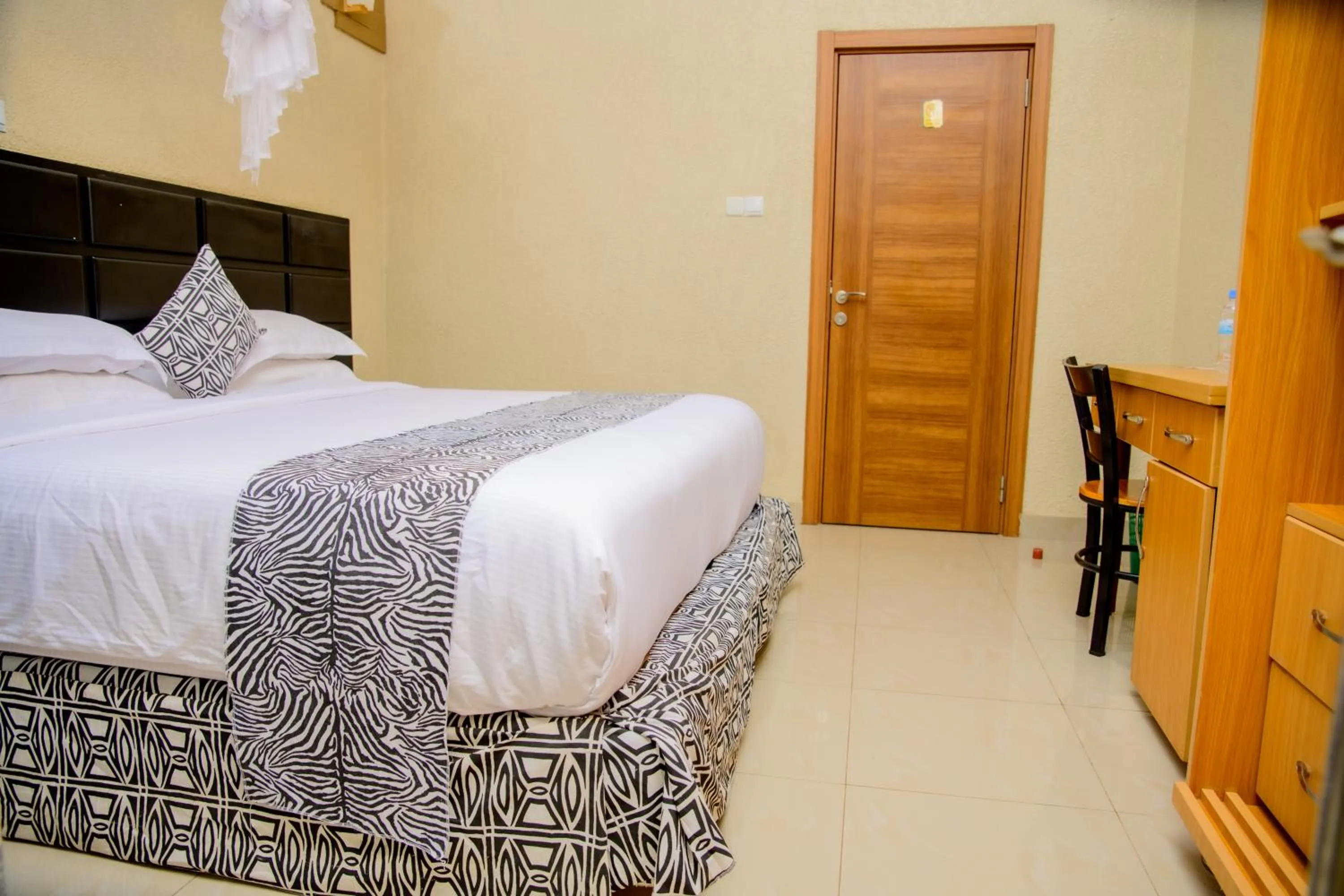 Bed in Quality Inn Hotel Kigali
