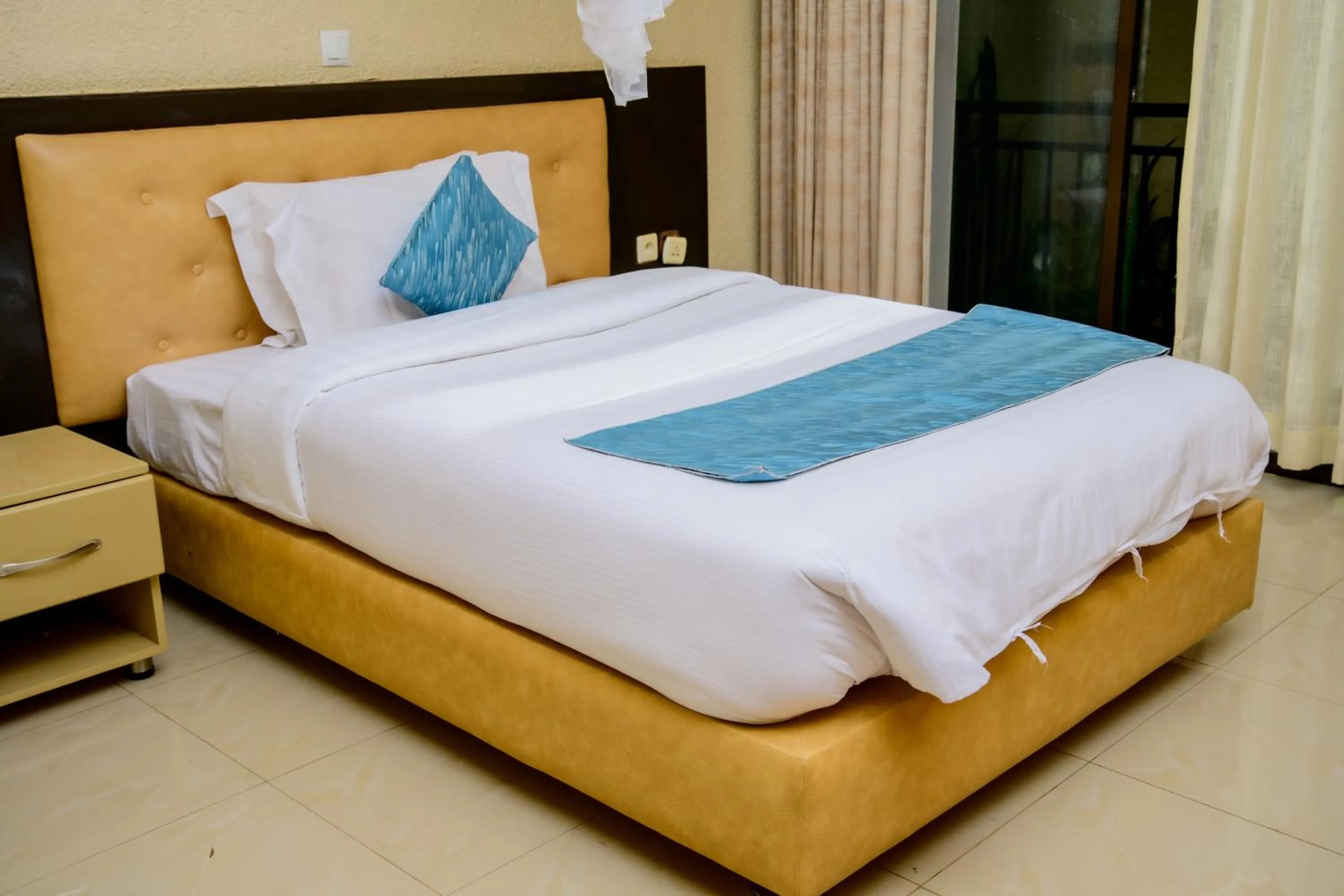 Bed in Quality Inn Hotel Kigali