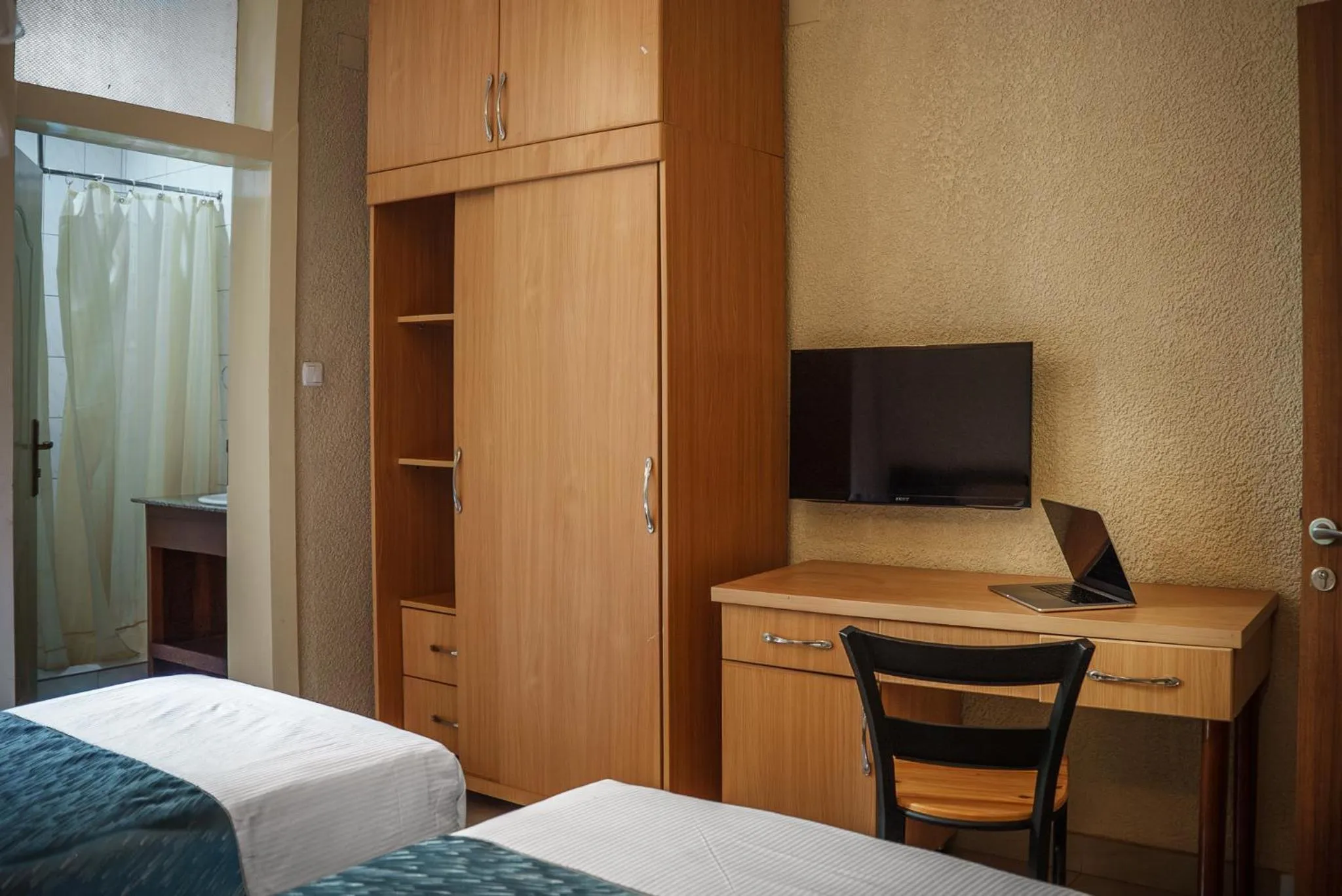 TV and multimedia, Bed in Quality Inn Hotel Kigali