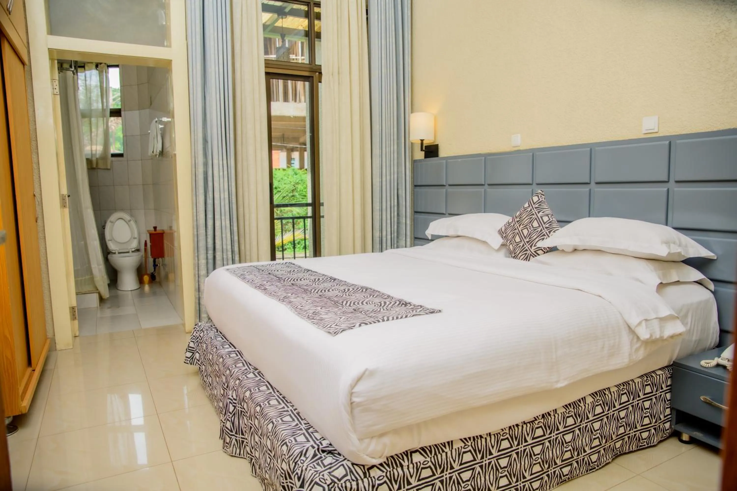 Bed in Quality Inn Hotel Kigali