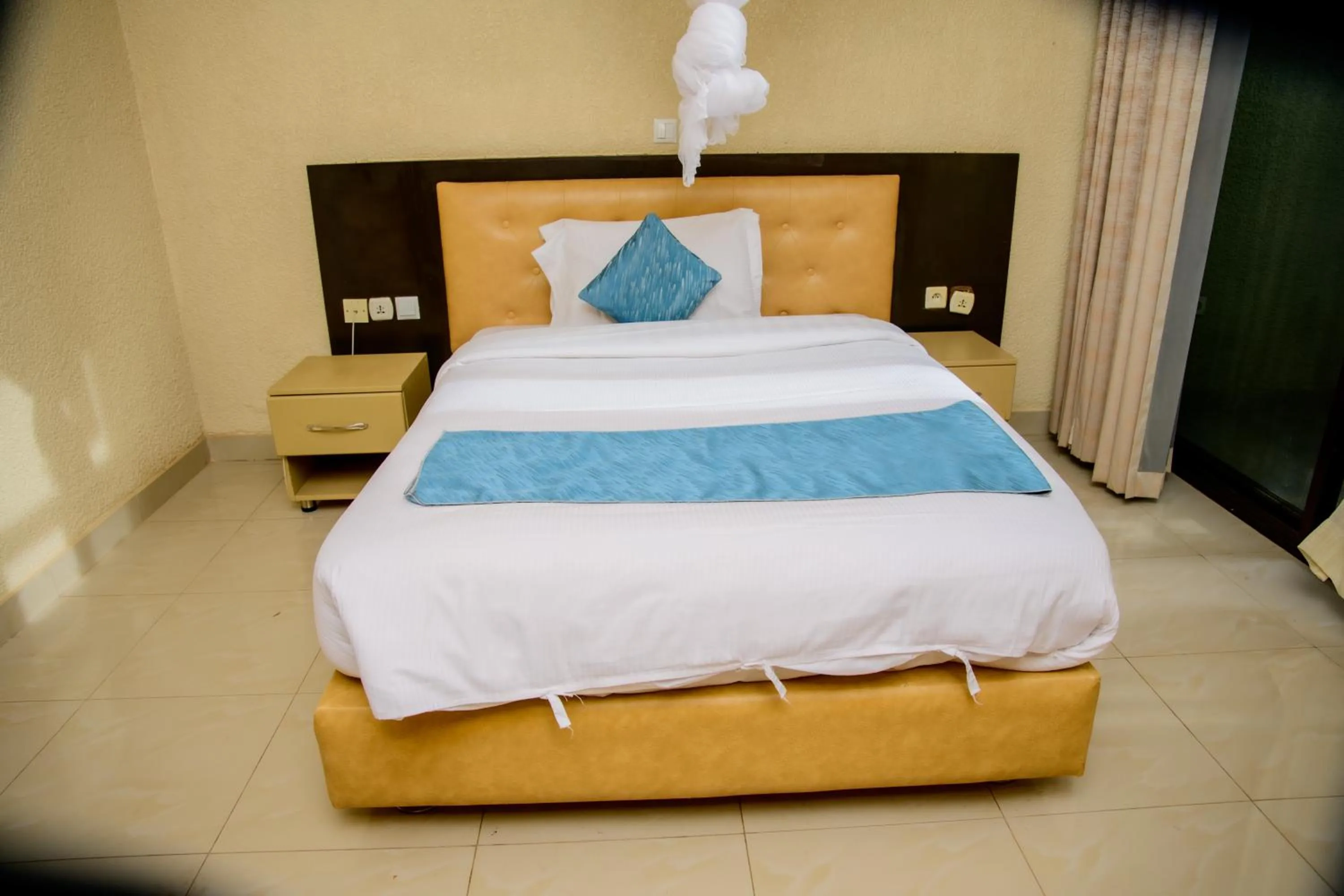 Bed in Quality Inn Hotel Kigali