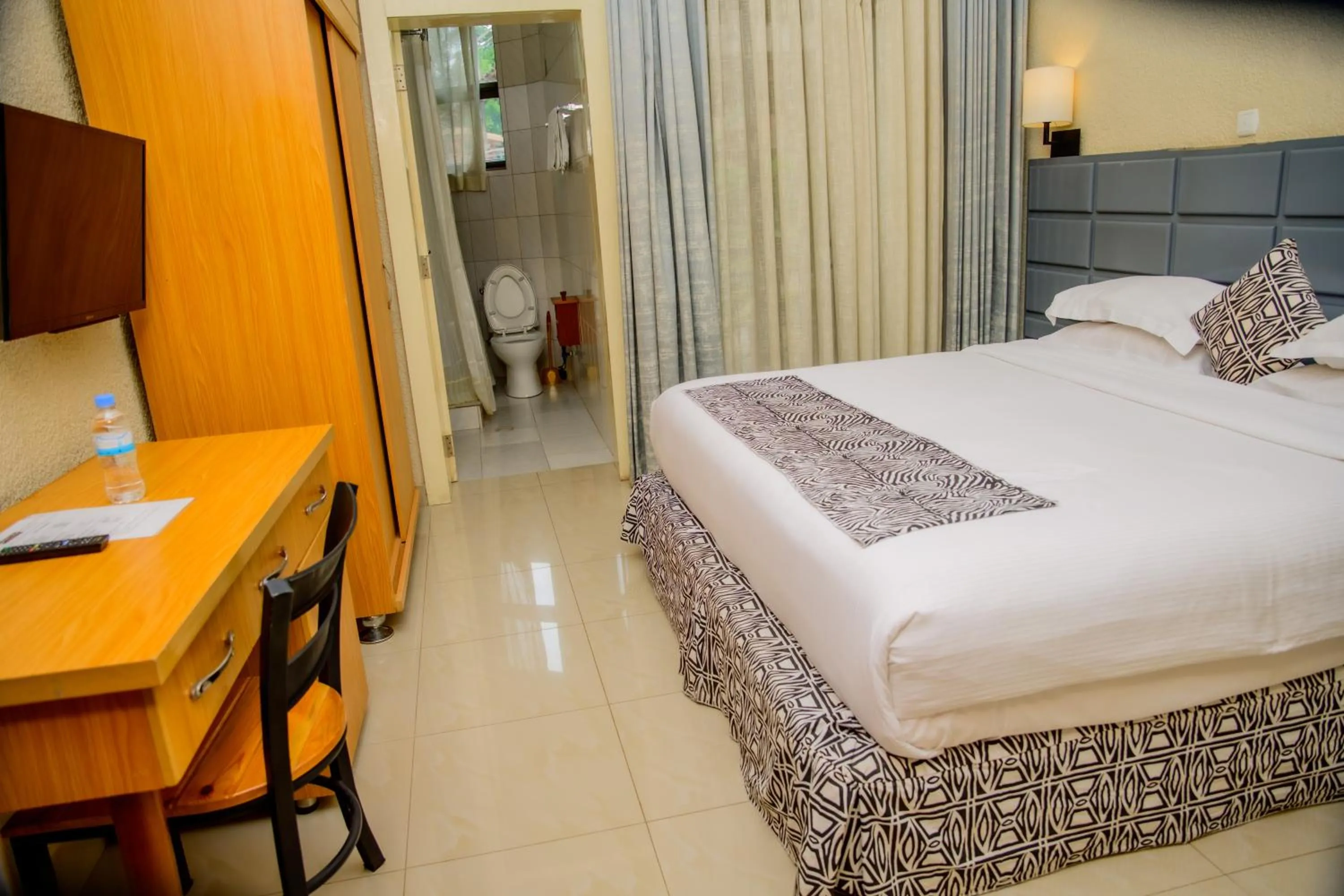 Bed in Quality Inn Hotel Kigali