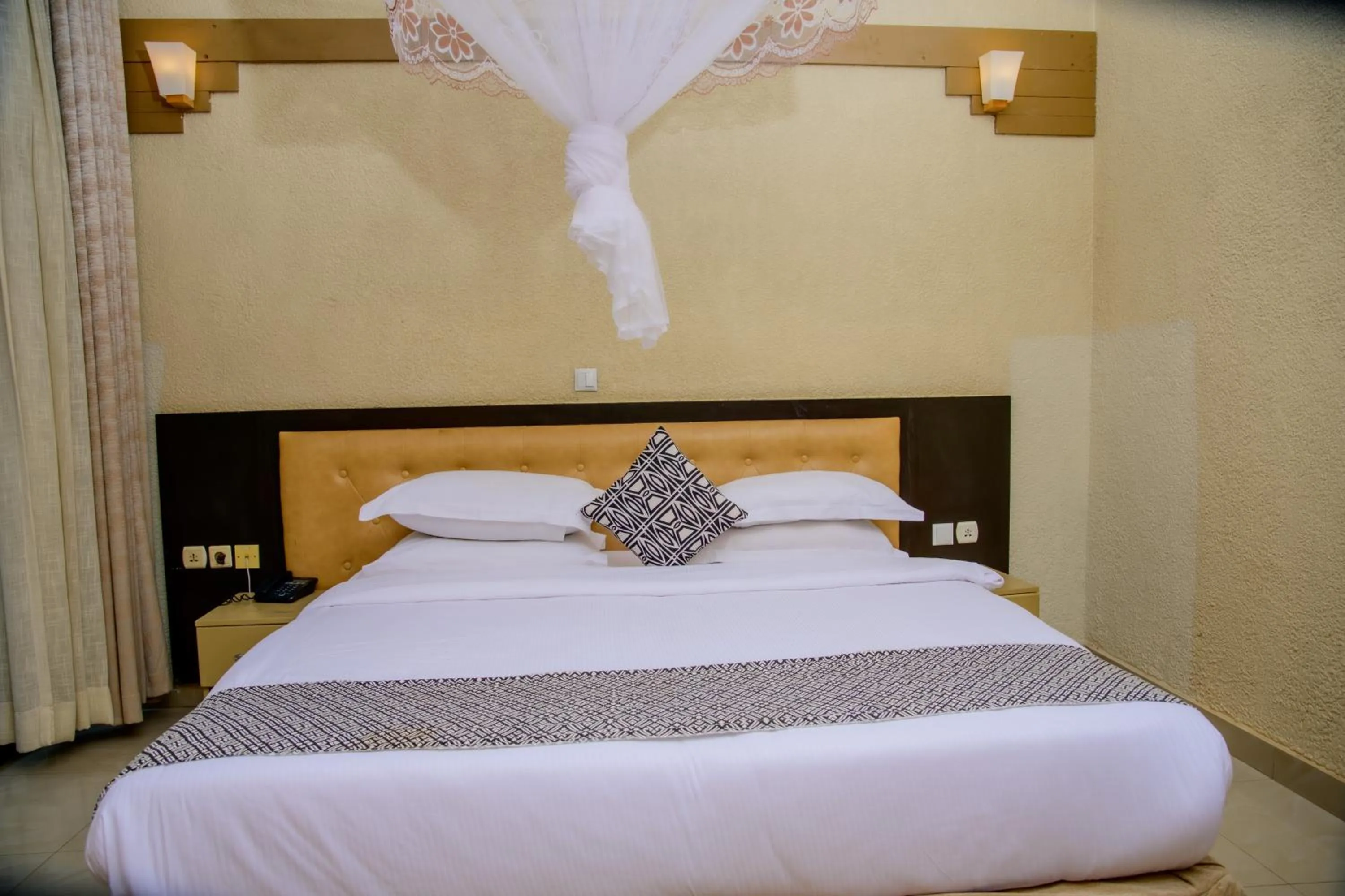 Bed in Quality Inn Hotel Kigali