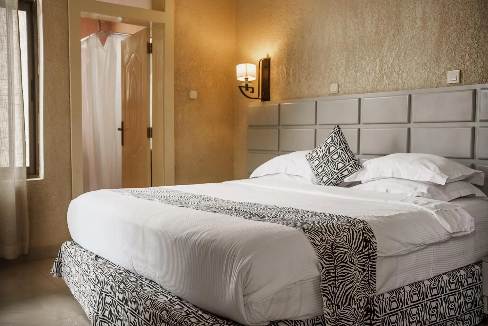 Bed in Quality Inn Hotel Kigali