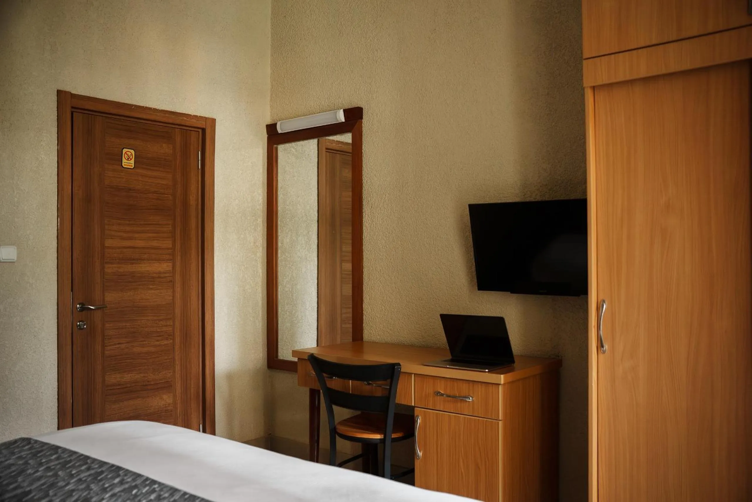 TV and multimedia, Bed in Quality Inn Hotel Kigali