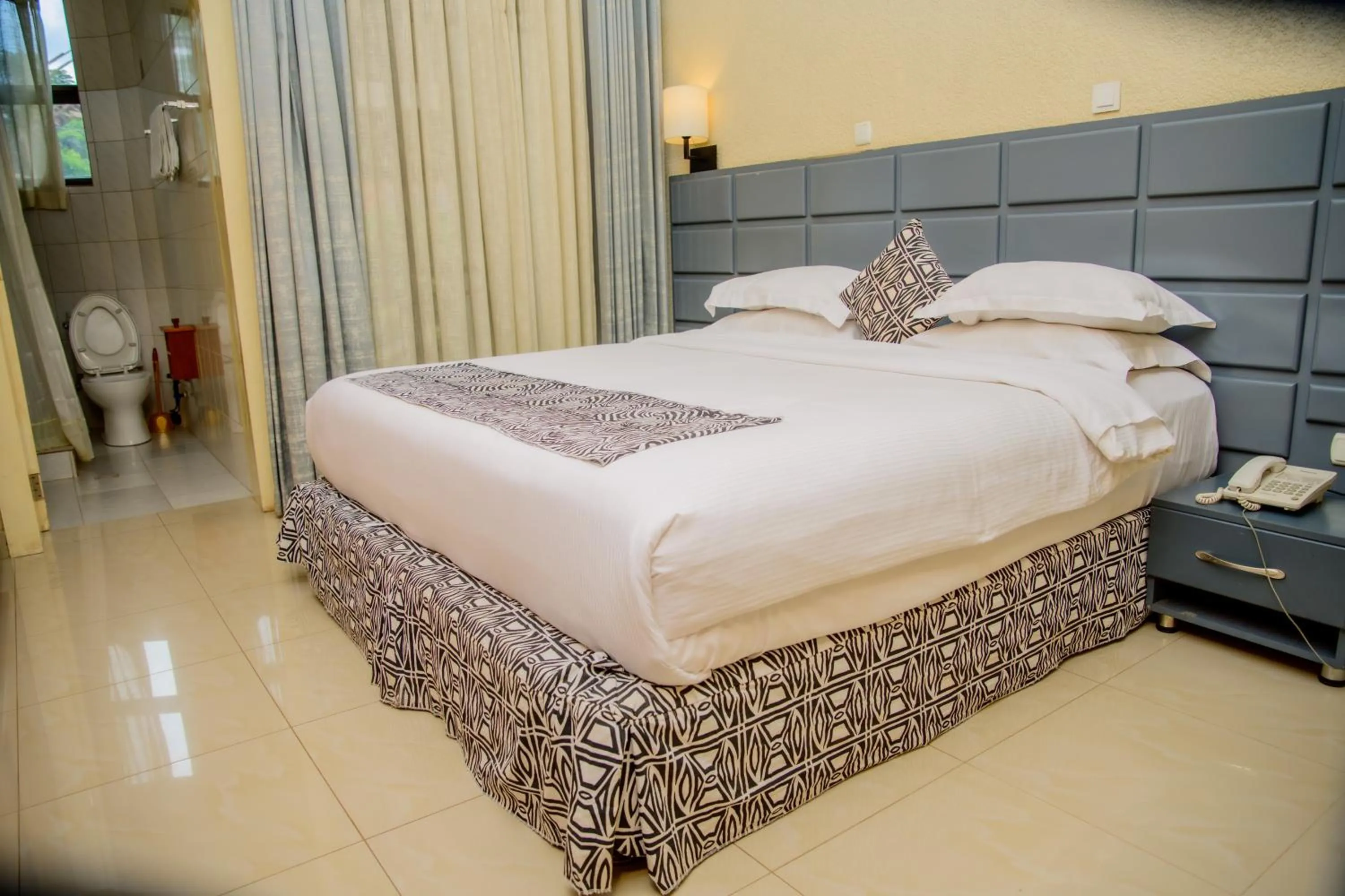 Bed in Quality Inn Hotel Kigali