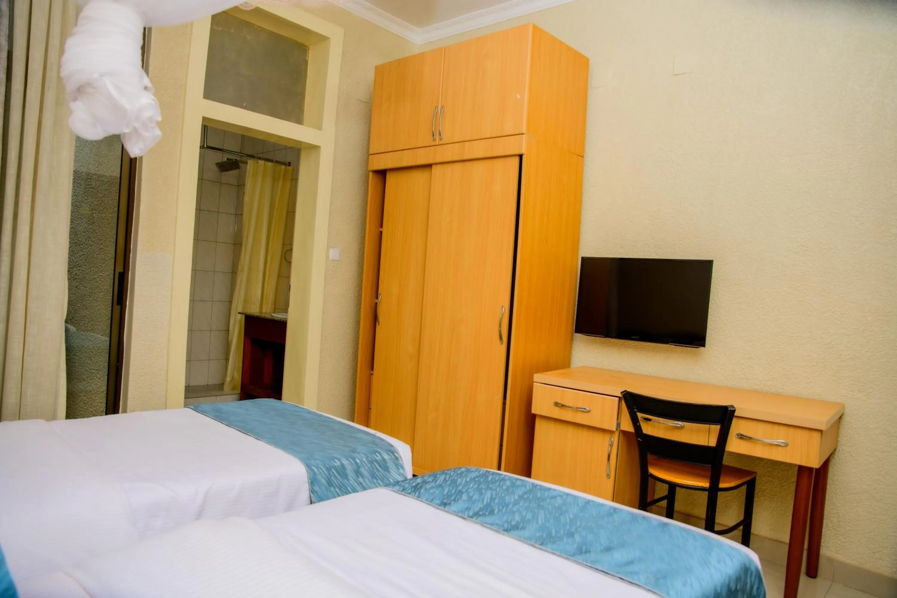 Bed in Quality Inn Hotel Kigali