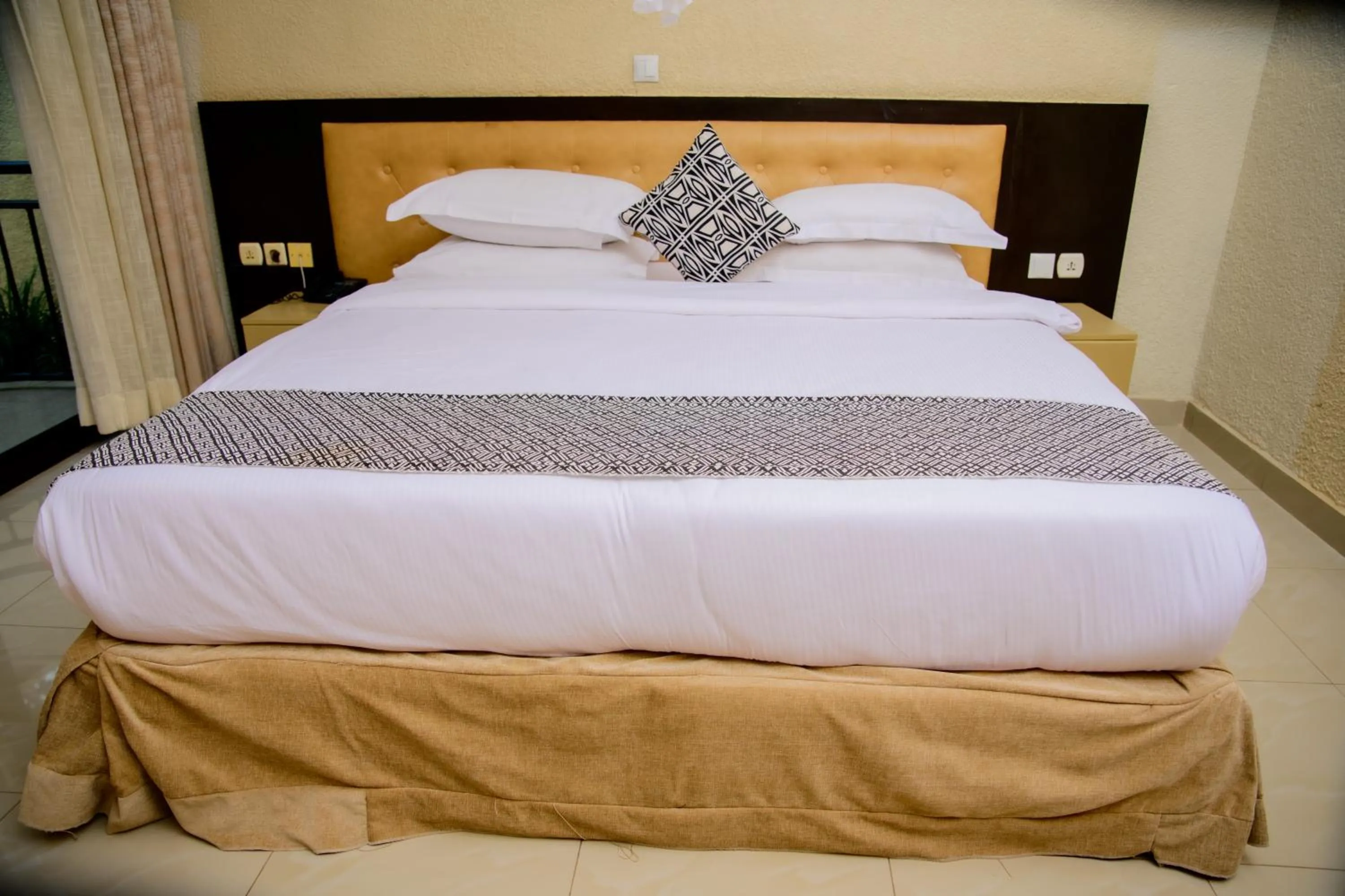 Bed in Quality Inn Hotel Kigali