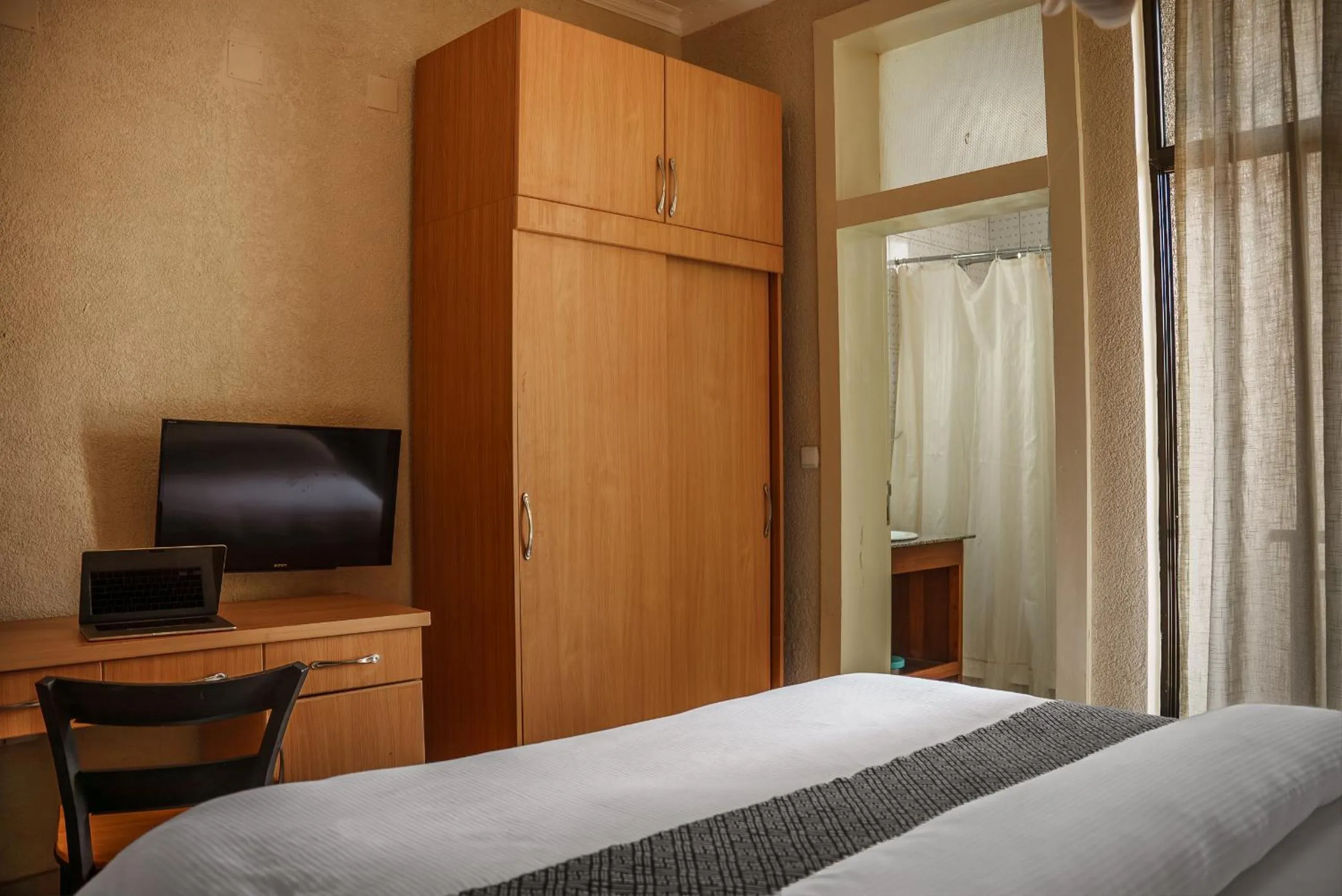 Bed in Quality Inn Hotel Kigali