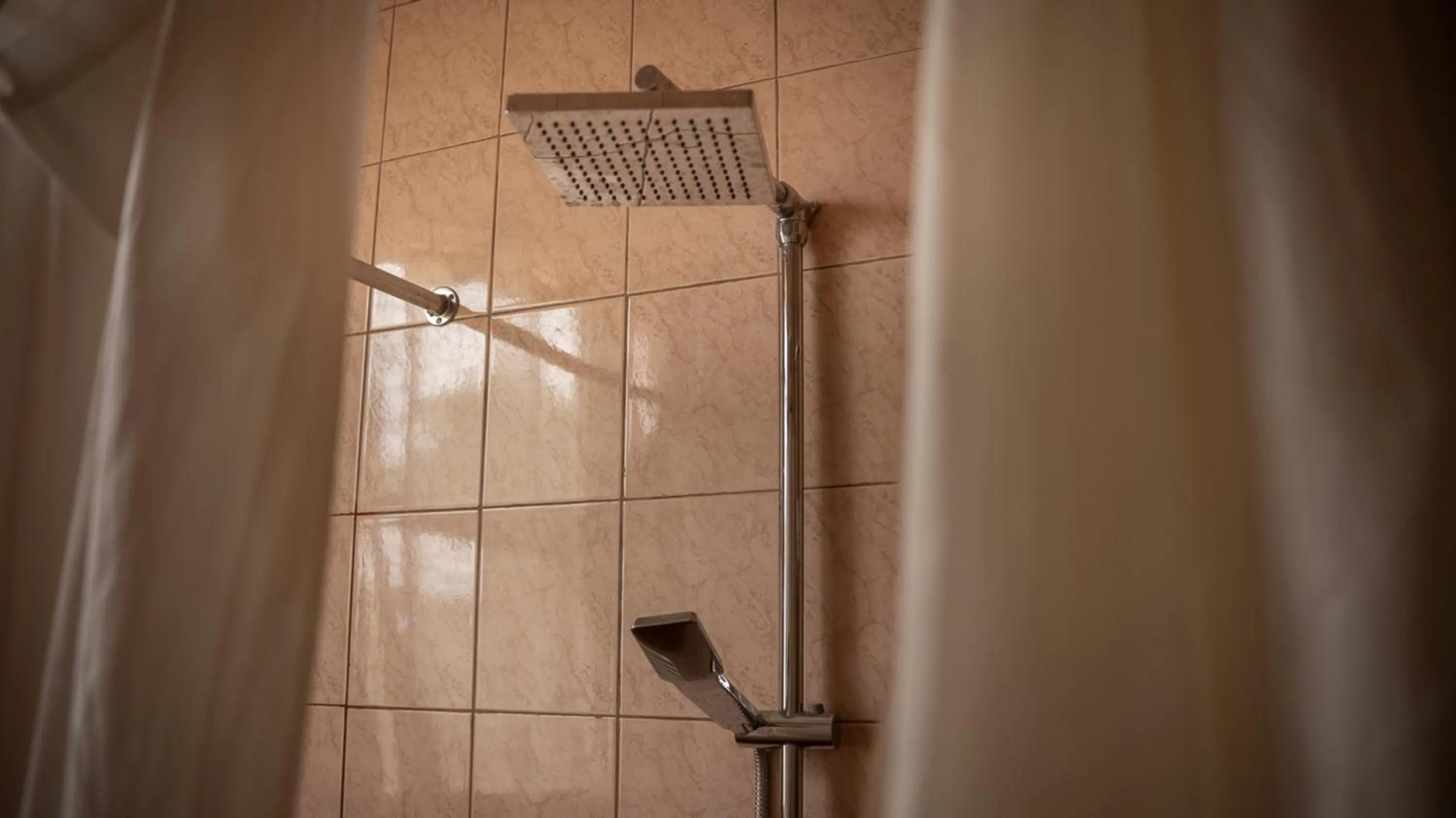Shower in Quality Inn Hotel Kigali