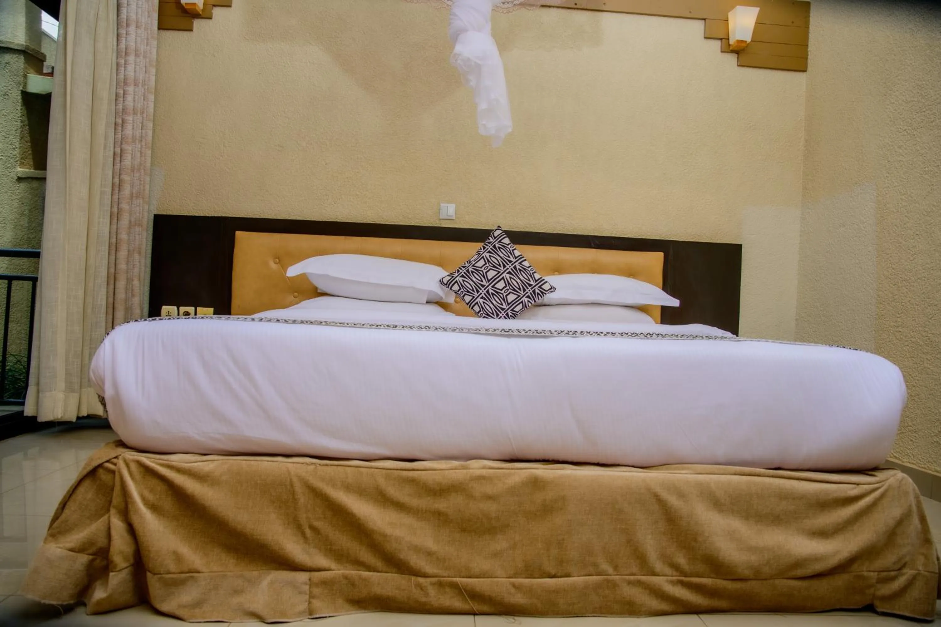 Bed in Quality Inn Hotel Kigali
