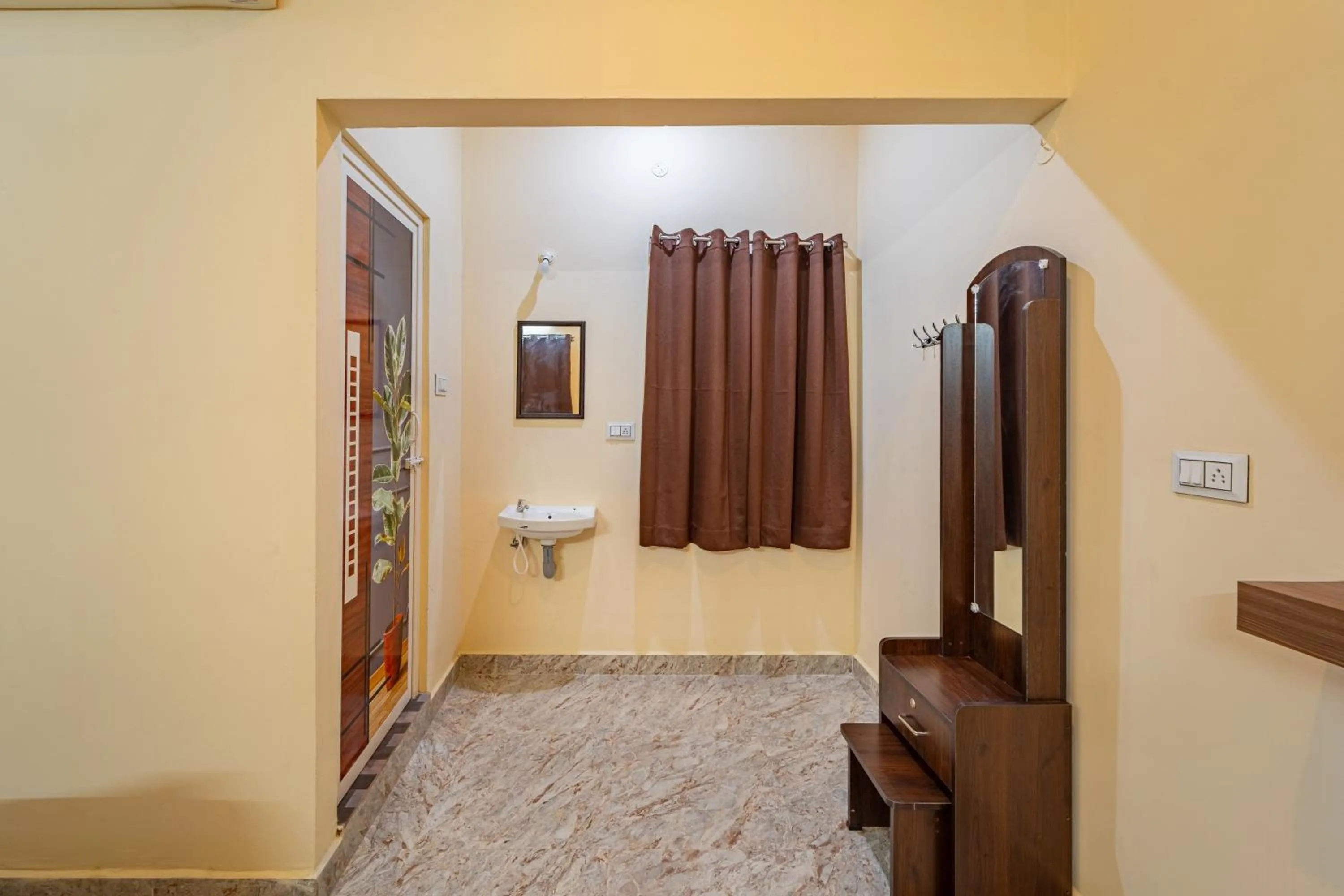Bedroom in Hotel De Jardin Pondicherry with Swimming Pool