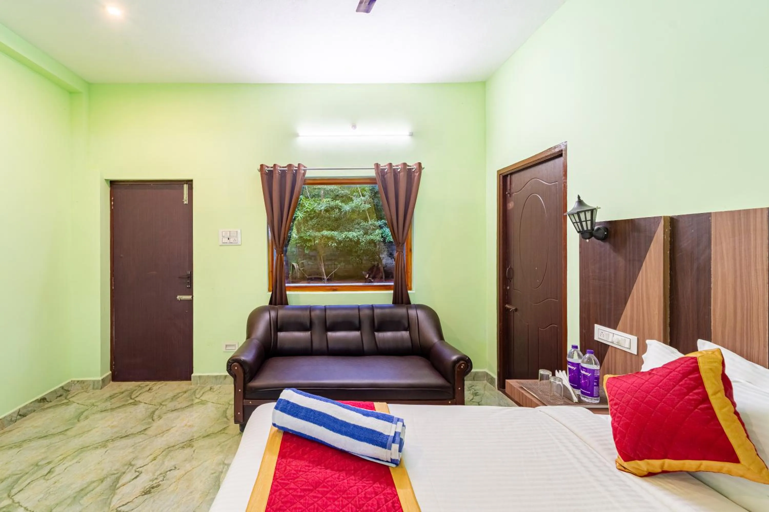 Bed in Hotel De Jardin Pondicherry with Swimming Pool