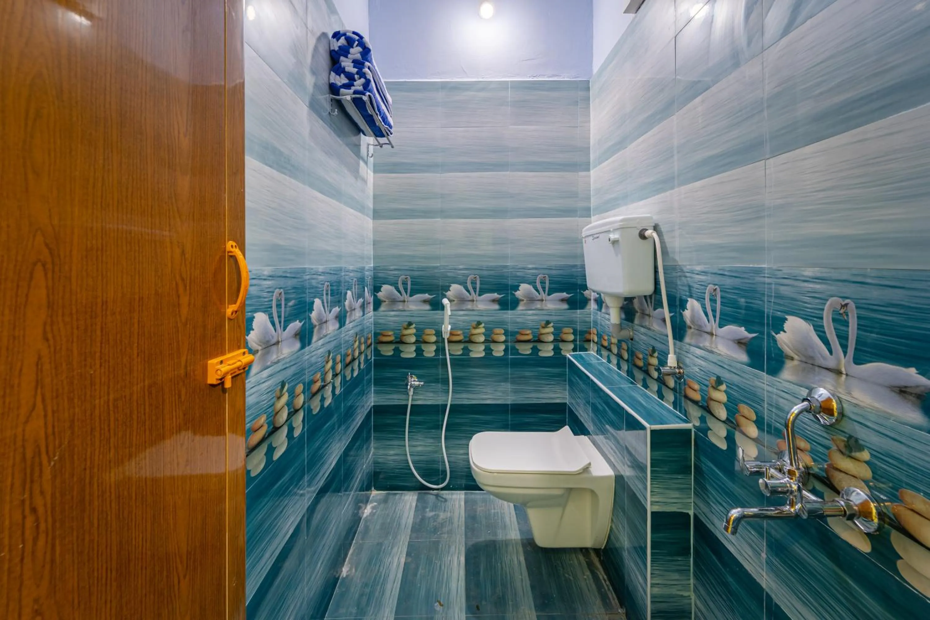 Toilet in Hotel De Jardin Pondicherry with Swimming Pool