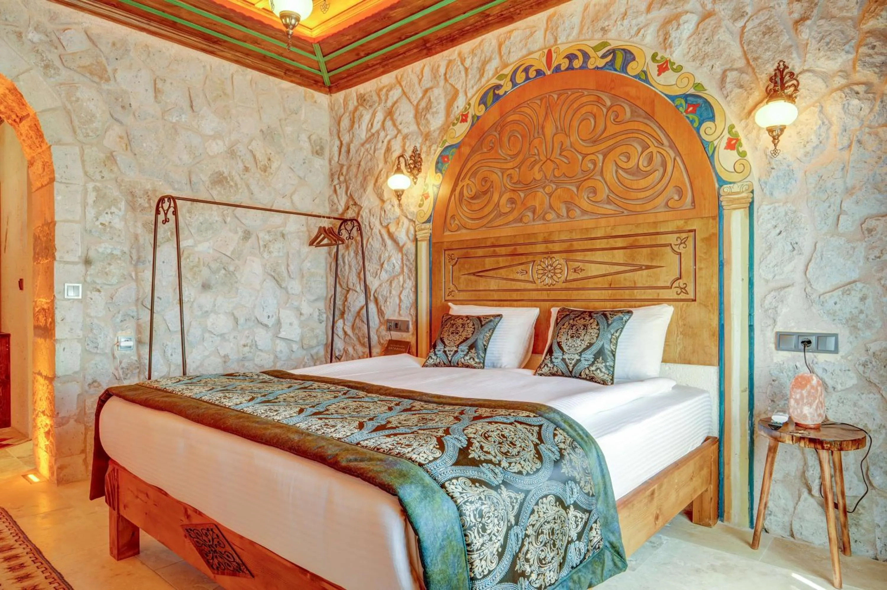 Bed in Kasr-ı Kapadokya Cave Suites