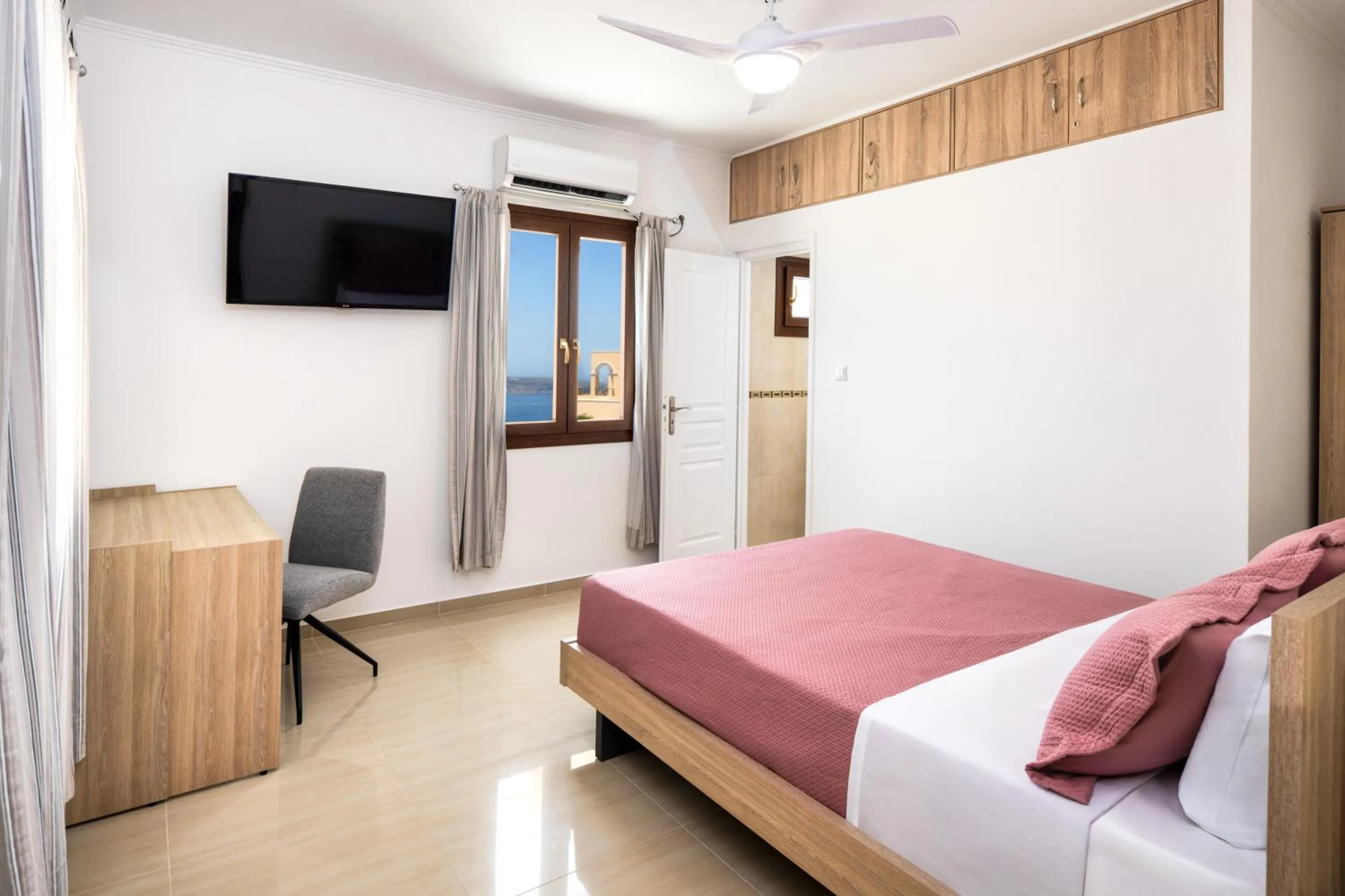 Bed in Santorinn Suites Fira