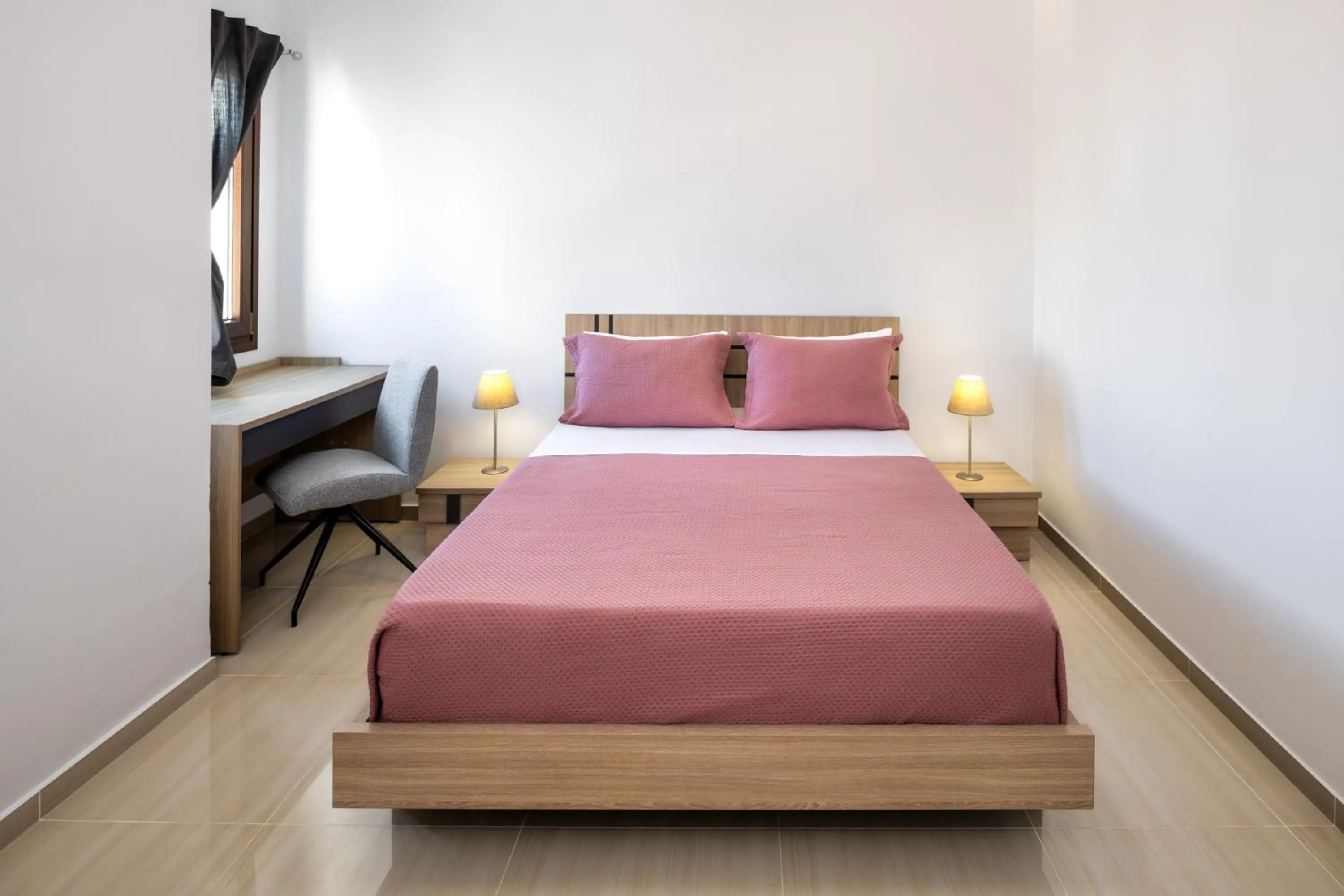 Bed in Santorinn Suites Fira