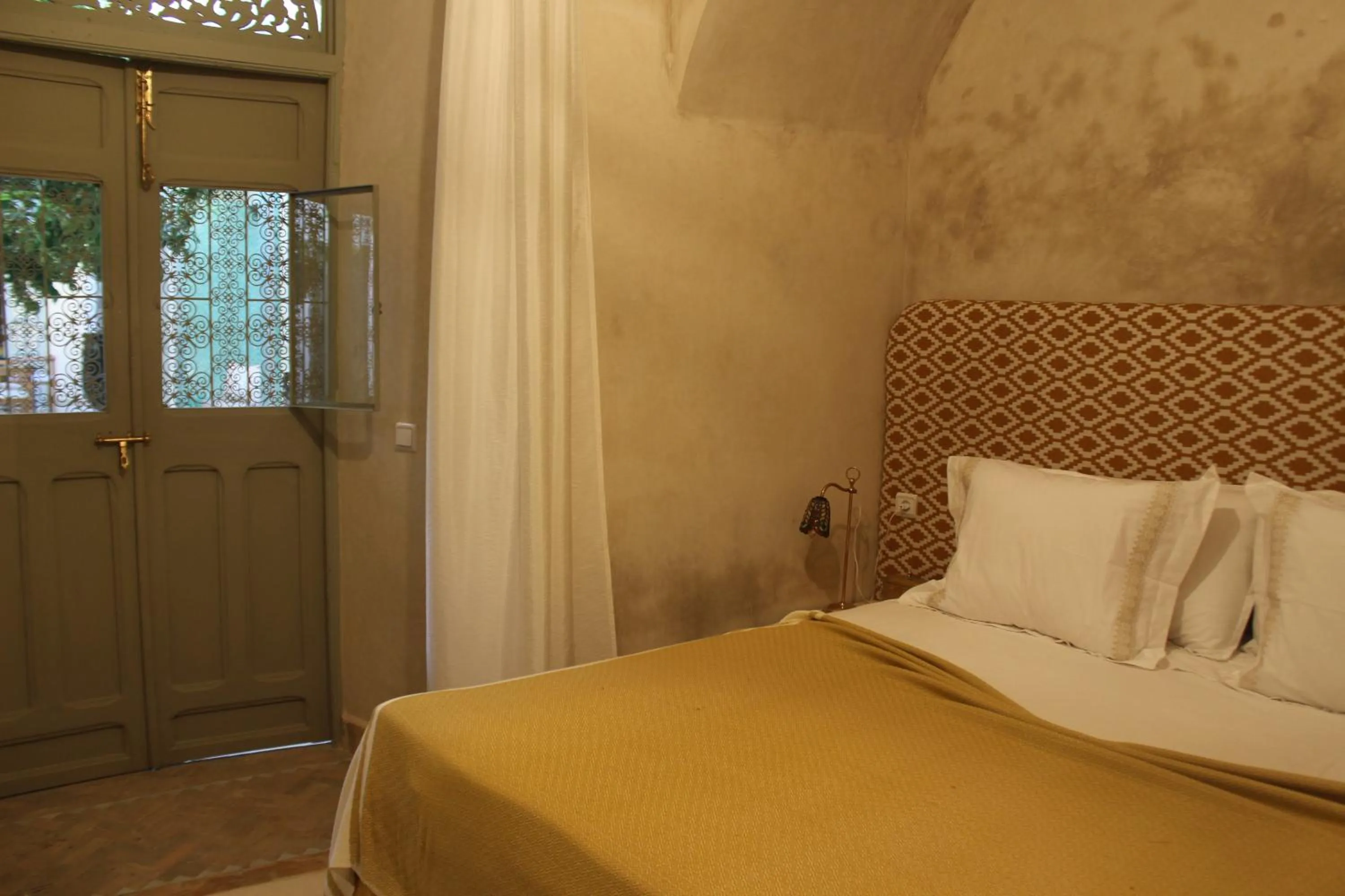 Bed in Riad Emberiza Sahari