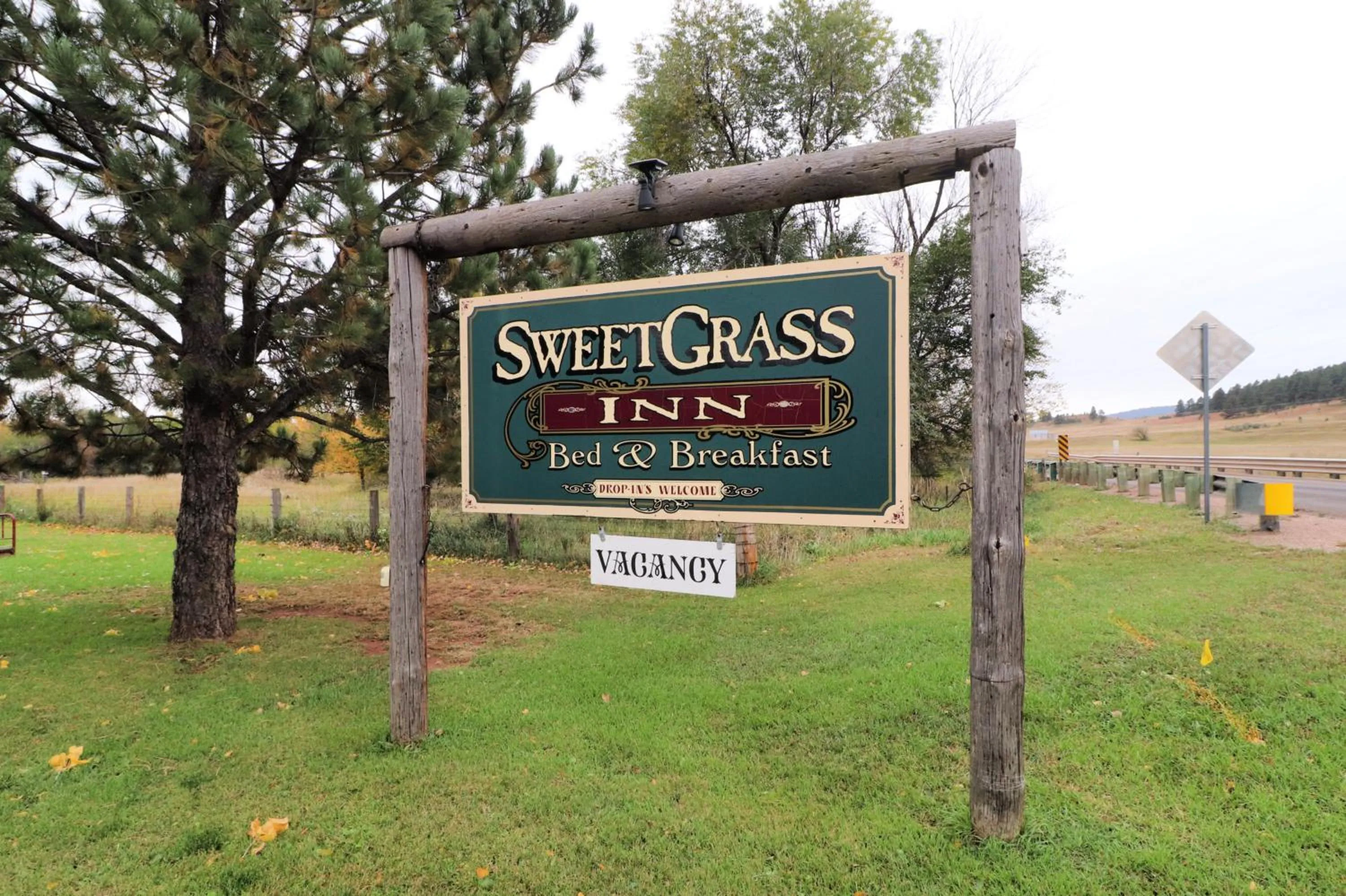 Property logo or sign in Sweetgrass Inn Bed & Breakfast