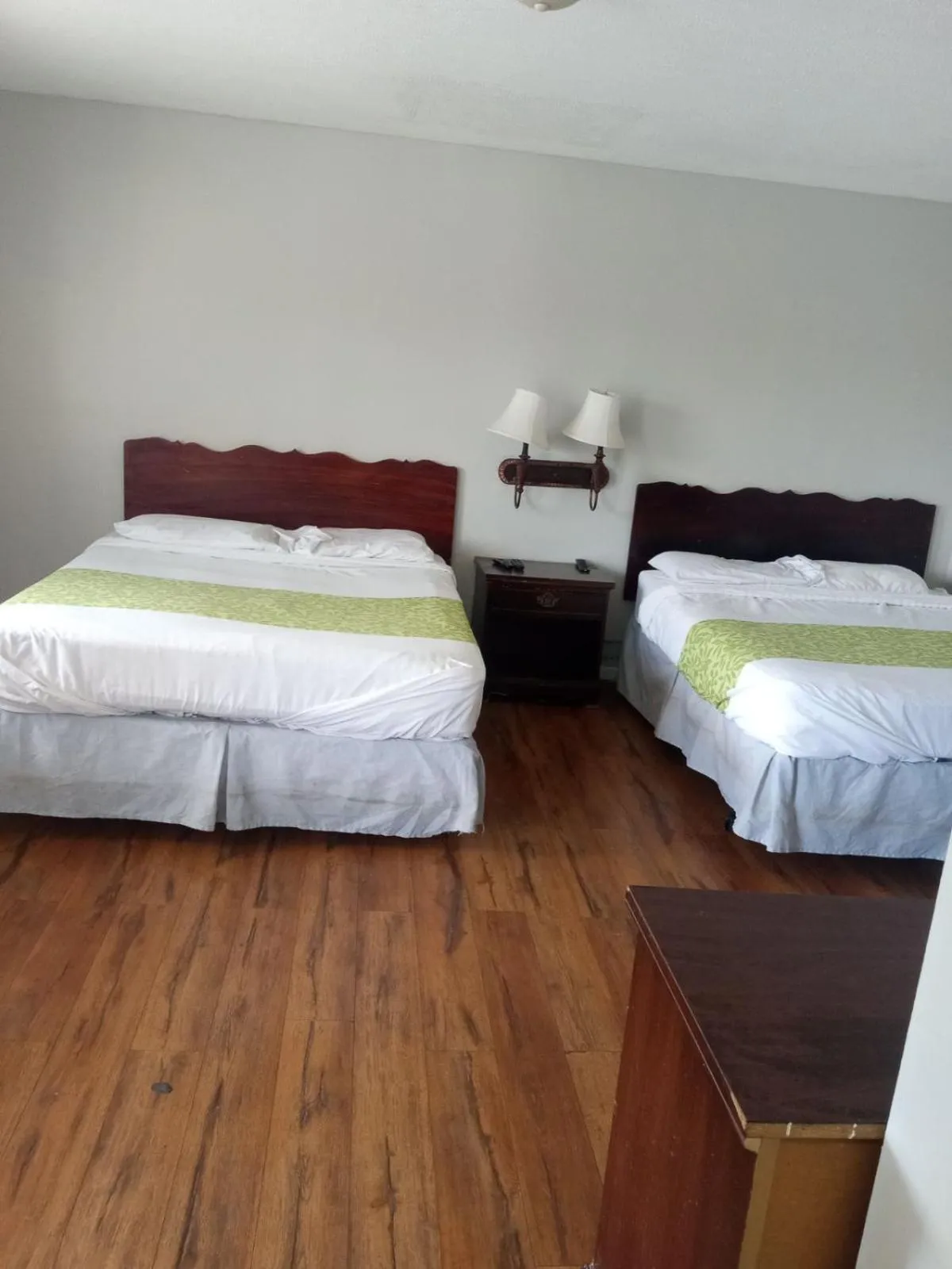 Bed in Dixie Plaza Hotel