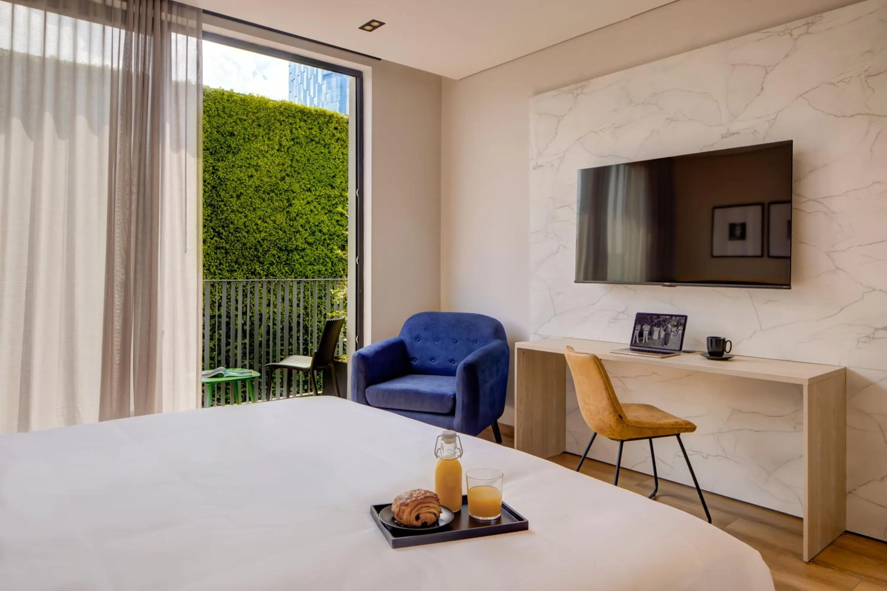 Bed in Vuestro Hotel Boutique