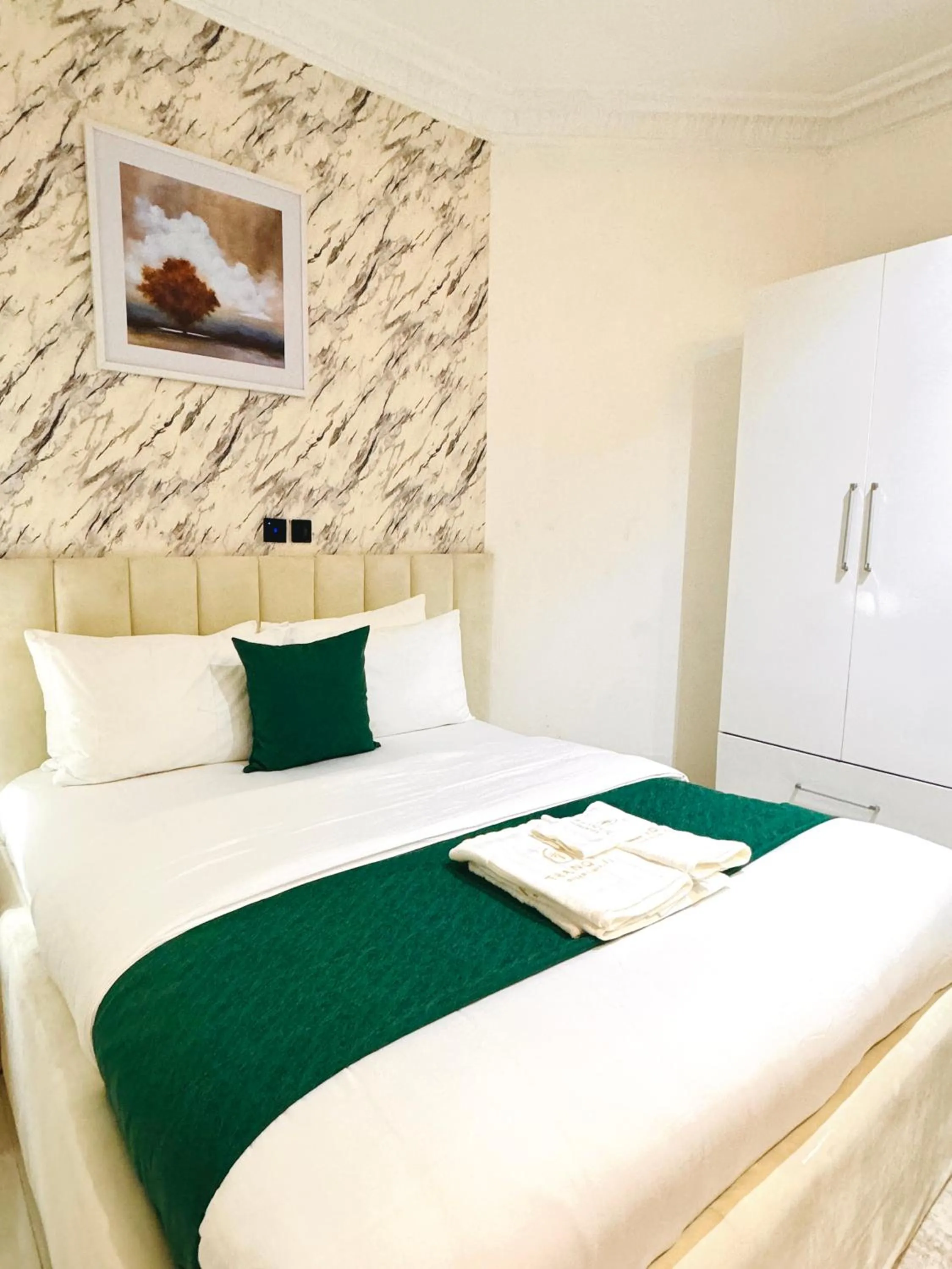 Bed in Tranquil Oasis Hotel