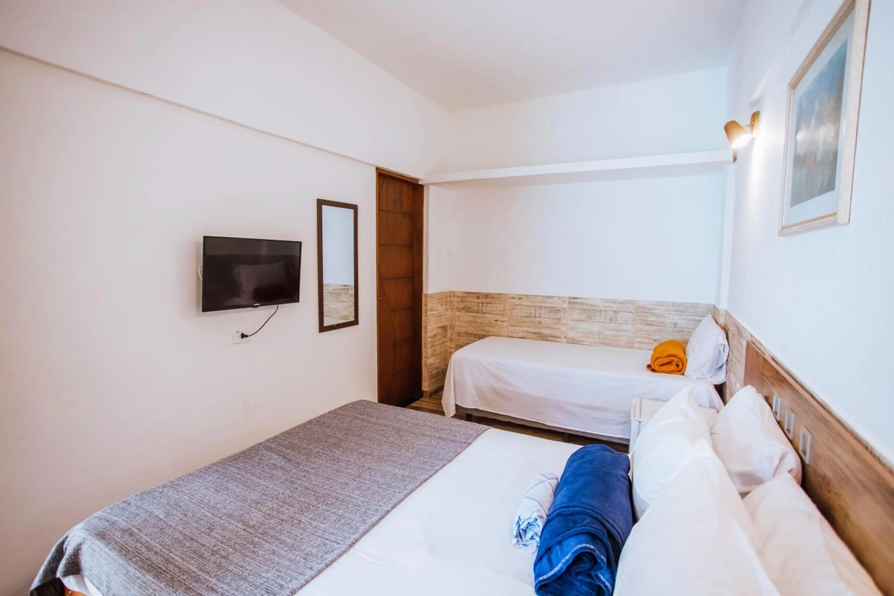 Bed in VELINN Pousada Praia do Perequê