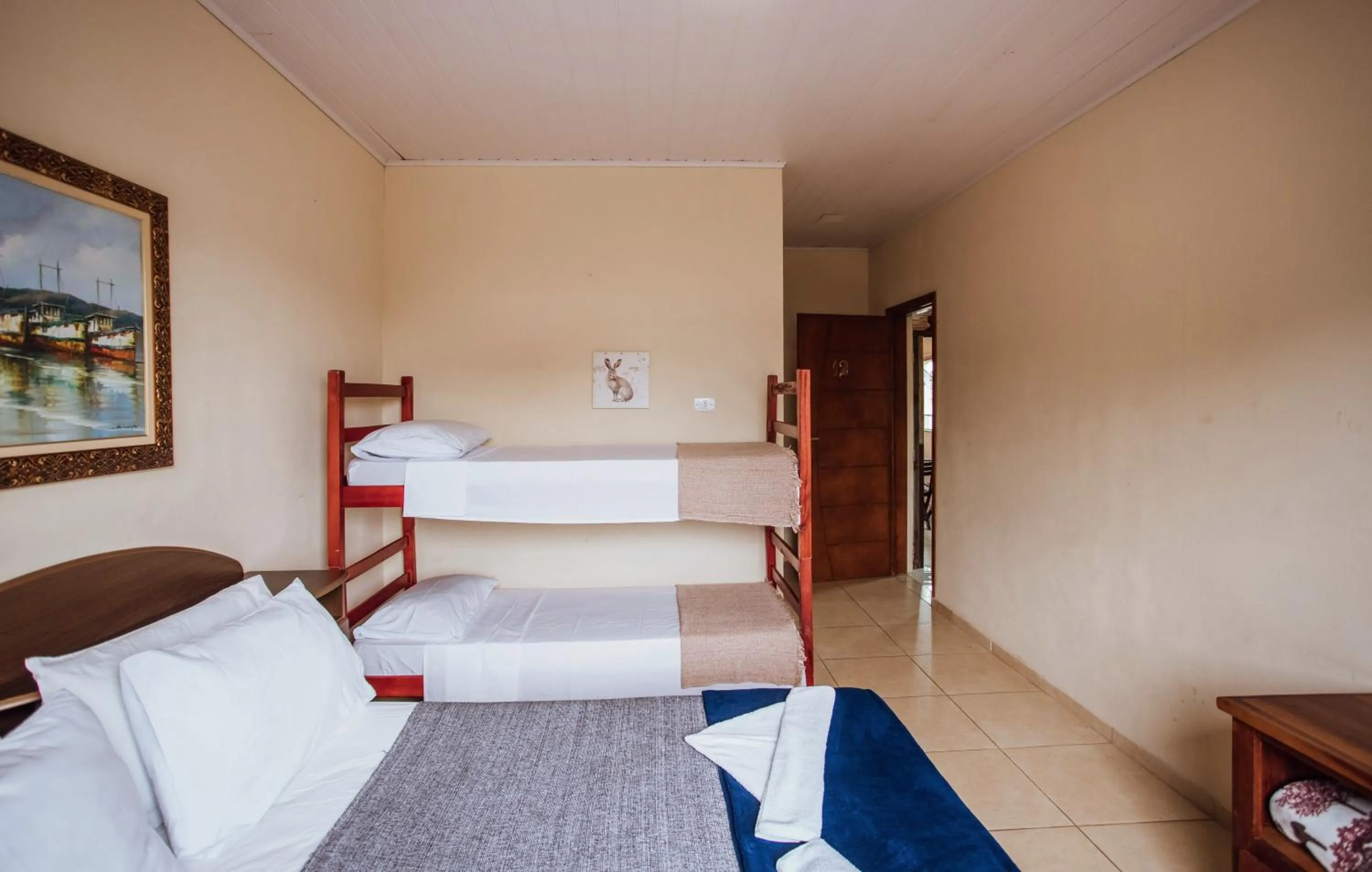 Bed in VELINN Pousada Praia do Perequê